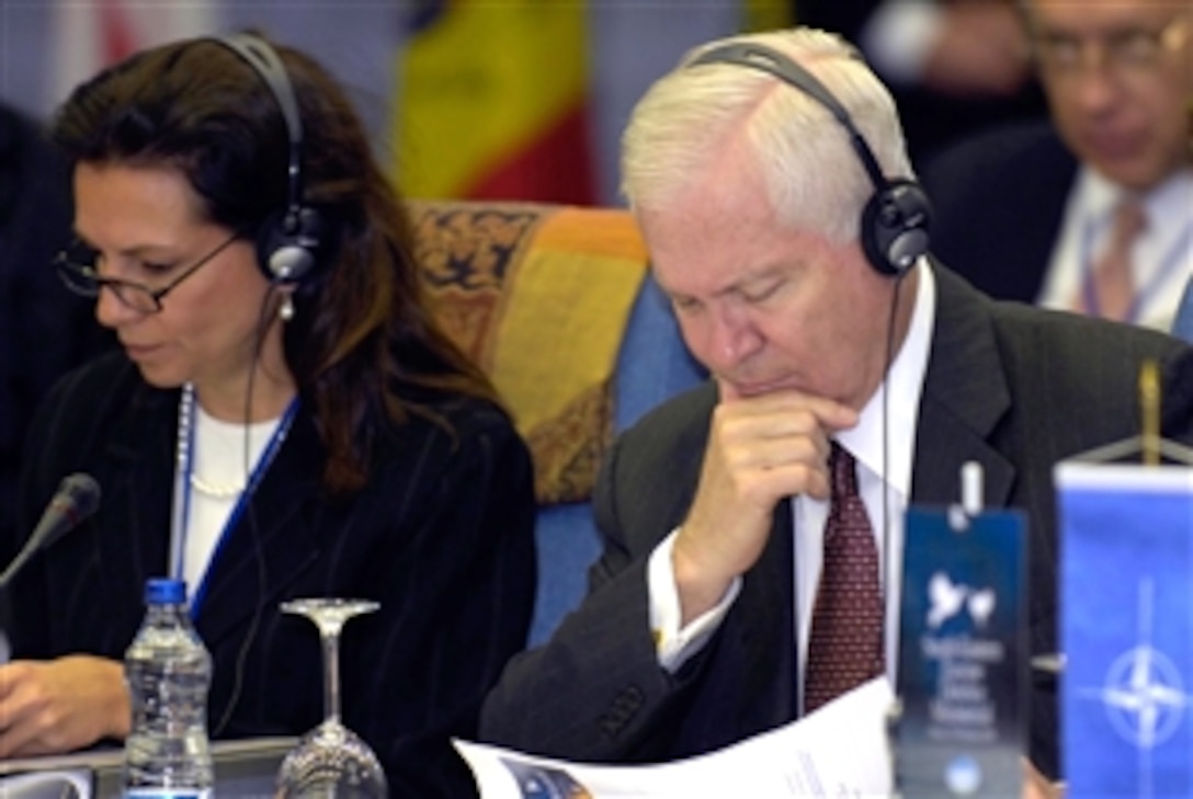 U.S. Defense Secretary Robert M. Gates, right, and Assistant Secretary of Defense for International Security Affairs Mary Beth Long listen to the opening remarks of the Southeastern European Defense Ministerial in Ohrid, Macedonia, Oct. 8, 2008. 
