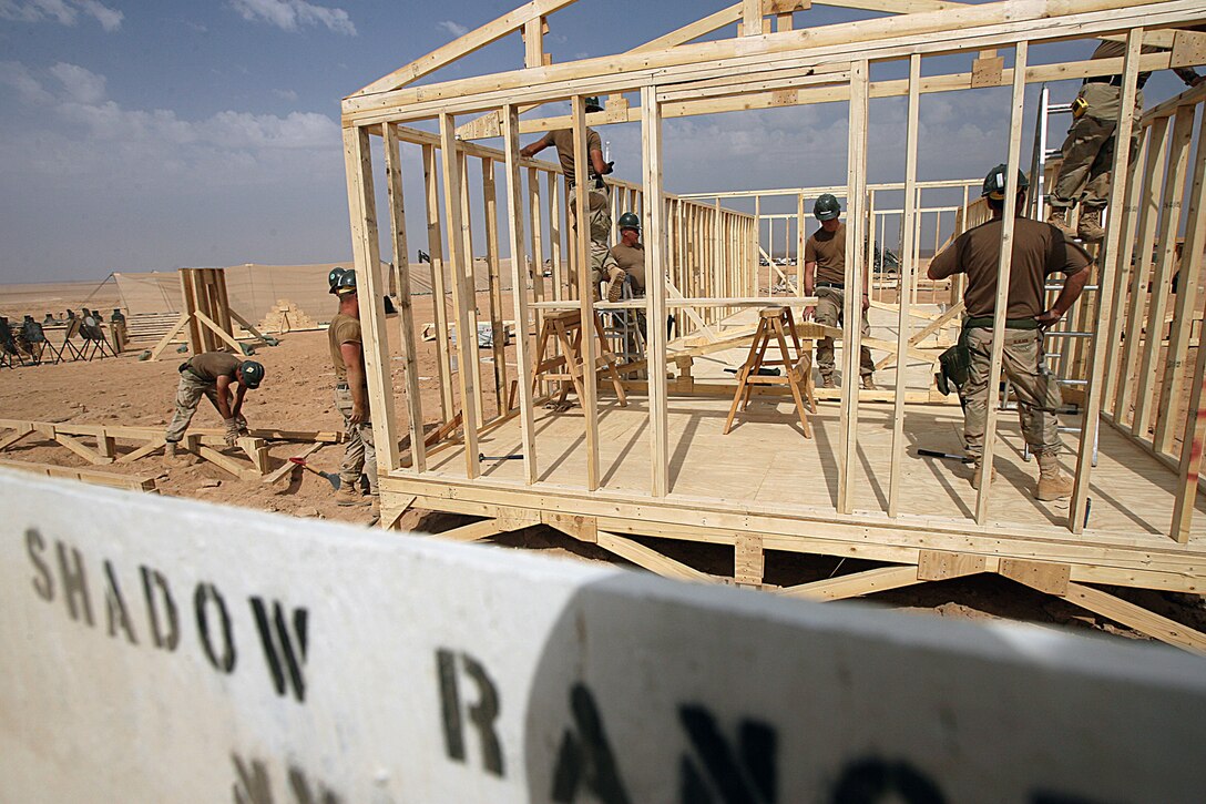 SHADOW RANGE, Iraq – While Seabees work on the new Command Operations Center, Marines from the Advanced Infantry Training Center put the finishing touches on a few of the ranges here Oct. 12. Shadow Range is a combined-arms range capable of supporting company-level training operations. Shadow is only initially capable right now, but plans are for the range to be fully operational this upcoming December or January. The courses offered here include a 14-day Tactical Small Unit Leaders Course, a seven-day Female Search Team certification course, a five-day Combined Arms Training Program for team to platoon sized training and a ten-day Combined Arms Training Program for team to company sized training. The range also supports mechanized assault training, aviation, artillery and mortar training.  (Marine photo by Cpl. GP Ingersoll)