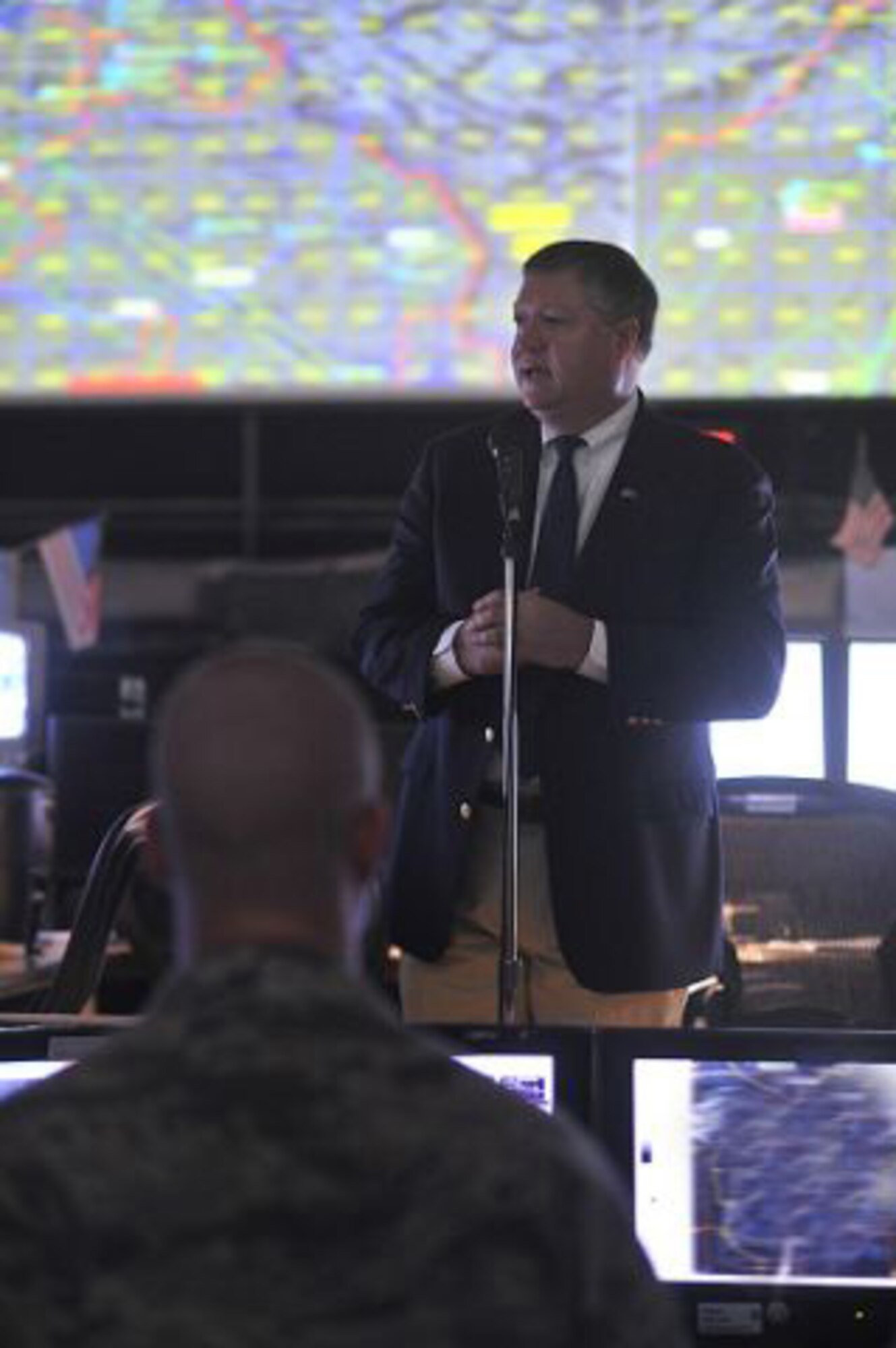 Secretary of the Air Force Michael Donley talks to military personnel on the operations floor of the Combined Air and Space Operations Center, located in Southwest Asia on Oct. 11. The CAOC provides the command and control of airpower throughout Iraq, Afghanistan and 25 other nations, extending from Central Asia to the Horn of Africa. (U.S. Air Force photo/Staff Sgt. Aaron Allmon)