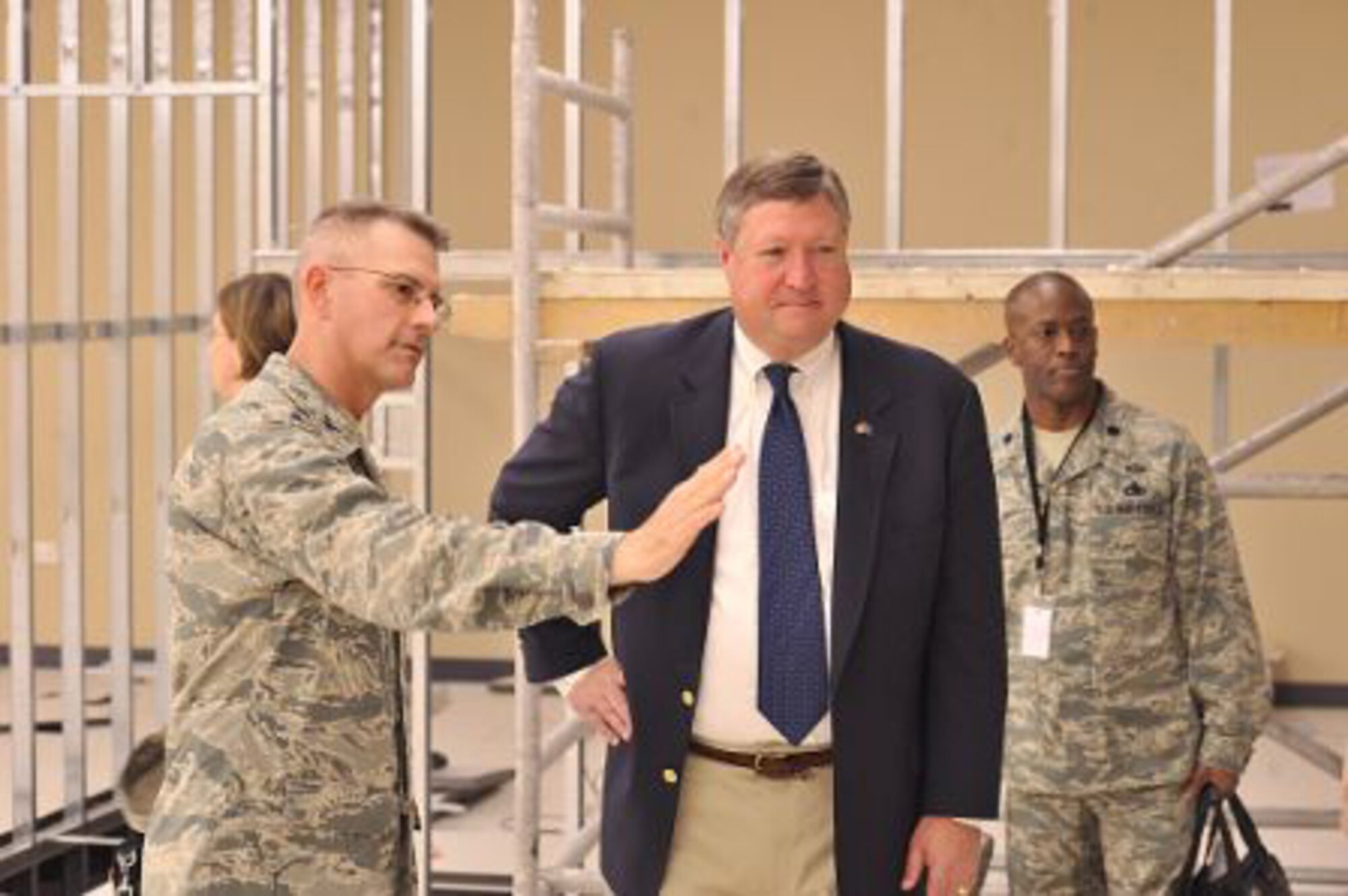 Col. Michael Humphrey from the Combined Air and Space Operations Center in Southwest Asia, explains to Air Force Secretary Michael Donley on Oct. 11 how construction is progressing on the new CAOC. The CAOC is the center of command and control of air operations for the global war on terrorism in Southwest Asia. (U.S. Air Force photo/Staff Sgt. Aaron Allmon)