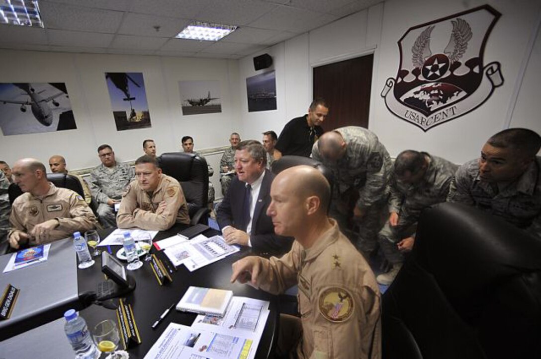 Secretary of the Air Force Michael Donley receives the Warfighter briefing Oct. 11 from Maj. Gen. Doug Raaberg, Deputy Combined Forces Air Component commander, U.S. Central Command at the Combined Air and Space Operations Center located in Southwest Asia. (U.S. Air Force photo/Staff Sgt. Aaron Allmon)