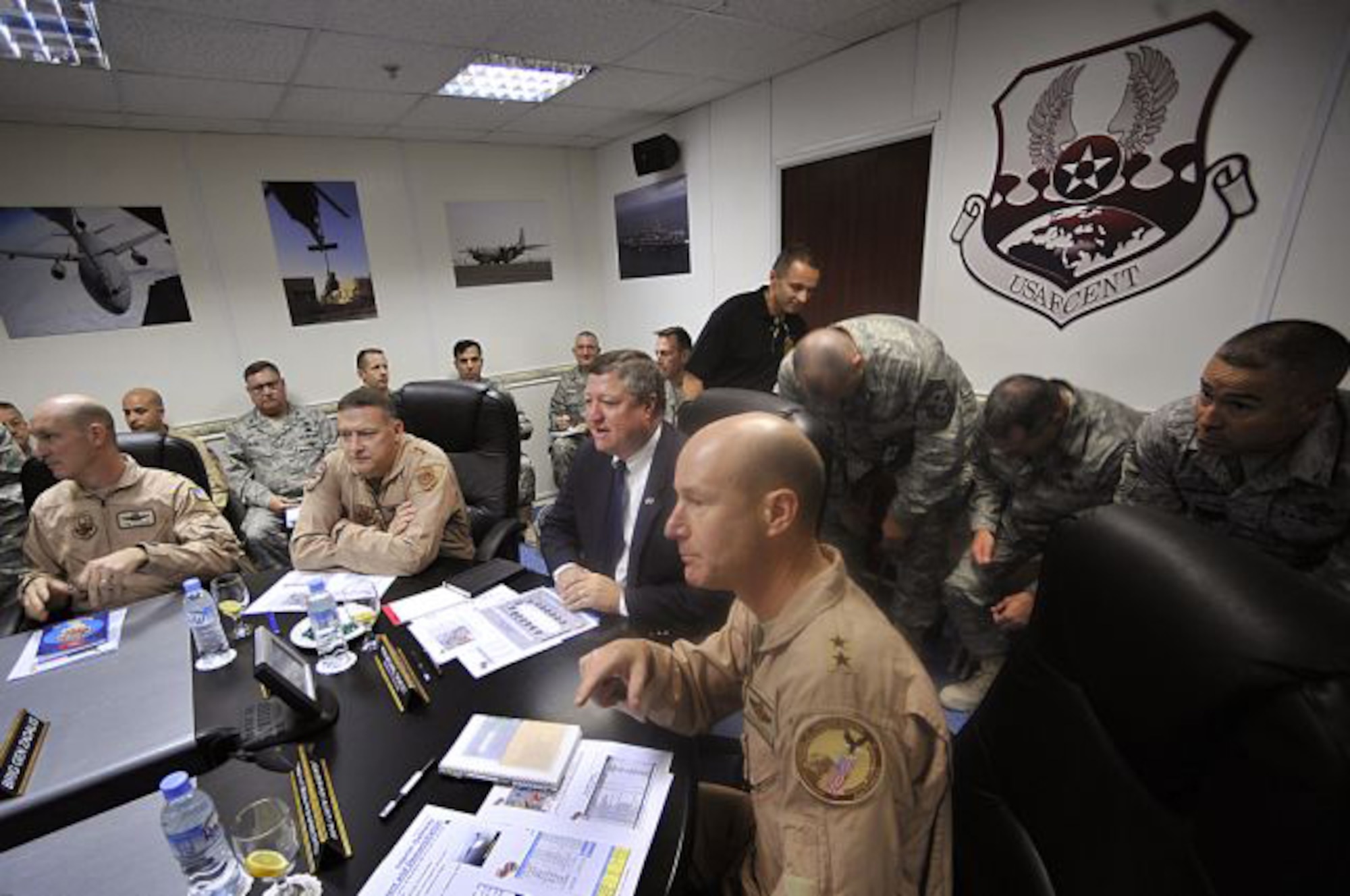 Secretary of the Air Force Michael Donley receives the Warfighter briefing Oct. 11 from Maj. Gen. Doug Raaberg, Deputy Combined Forces Air Component commander, U.S. Central Command at the Combined Air and Space Operations Center located in Southwest Asia. (U.S. Air Force photo/Staff Sgt. Aaron Allmon)
