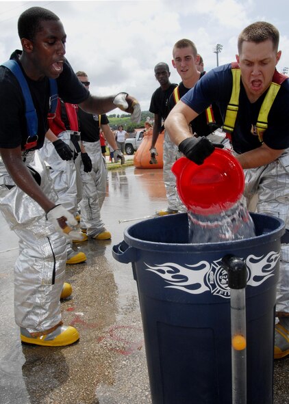 ANDERSEN AIR FORCE BASE, Guam - Team Andersen Fire and Emergency Service firefighters participate in the "Bucket Brigade" portion of the 2008 Guam Fire Muster Competition at Paseo Park in Chamorro Village Oct. 12. The annual competition is open to the U.S. Air Force, U.S. Navy and all local Guam fire stations. (U.S. Air Force photo by Airman 1st Class Nichelle Griffiths)