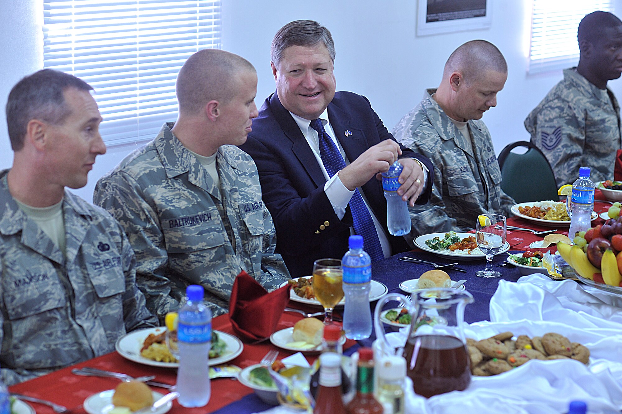 Secretary of the Air Force Michael Donley shares lunch with the Combined Air and Space Operations Center award winners. Located in Southwest Asia, the CAOC provides command and control of airpower throughout Iraq, Afghanistan and 25 other nations. (U.S. Air Force photo by Staff Sgt. Aaron Allmon)
