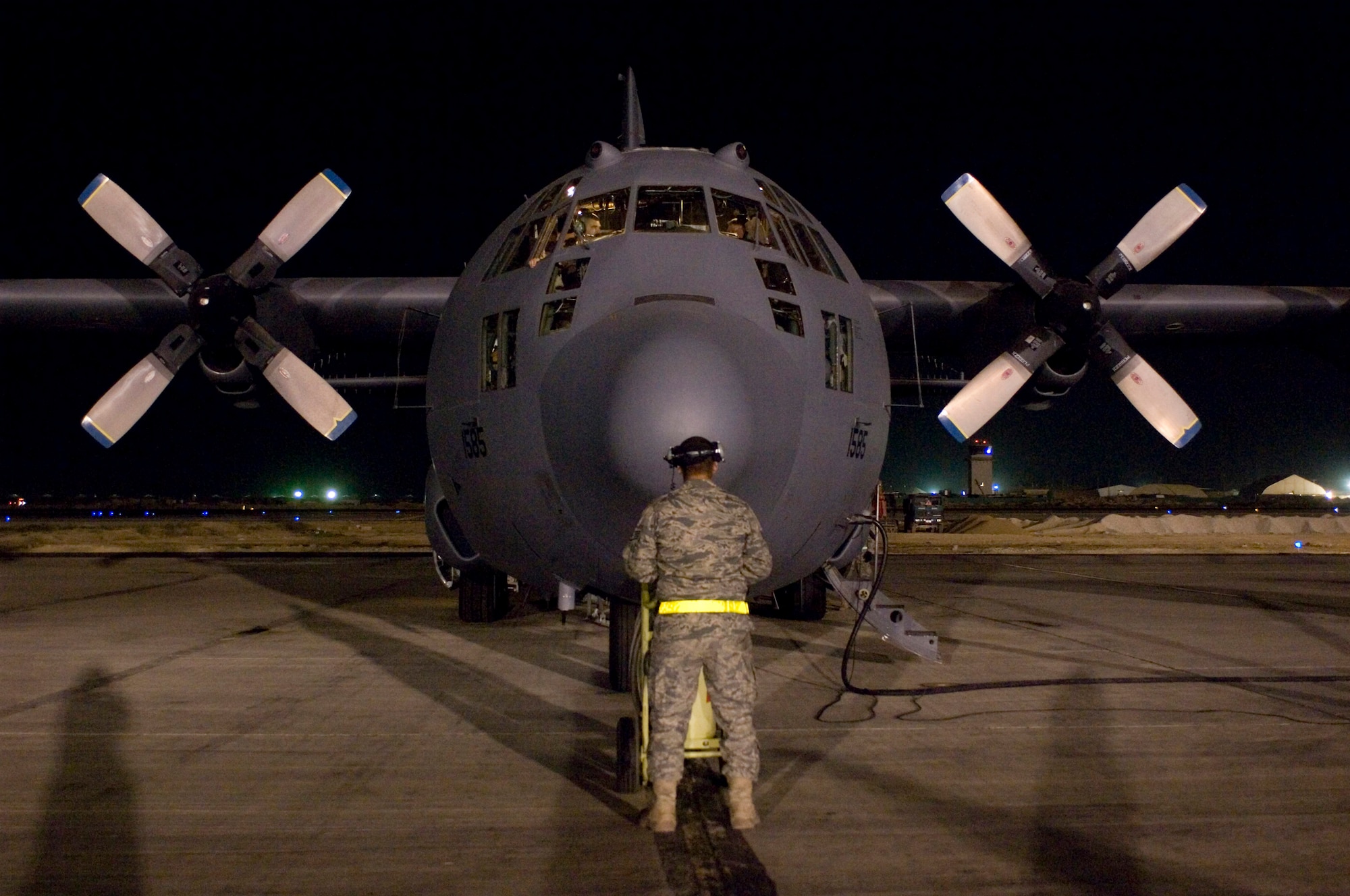 Staff Sgt. Alex Rosales, a crew chief for the 41st Expeditionary Electronic Attack Squadron, prepares to launch an EC-130H Compass Call on the flightline at Bagram Air Field, Afghanistan, Oct. 6. It took 80,000 maintenance hours to help the 41st EECS fly more than 10,000 combat hours in support of Operation Enduring Freedom. (U.S. Air Force photo by Staff Sgt. Rachel Martinez/Released)