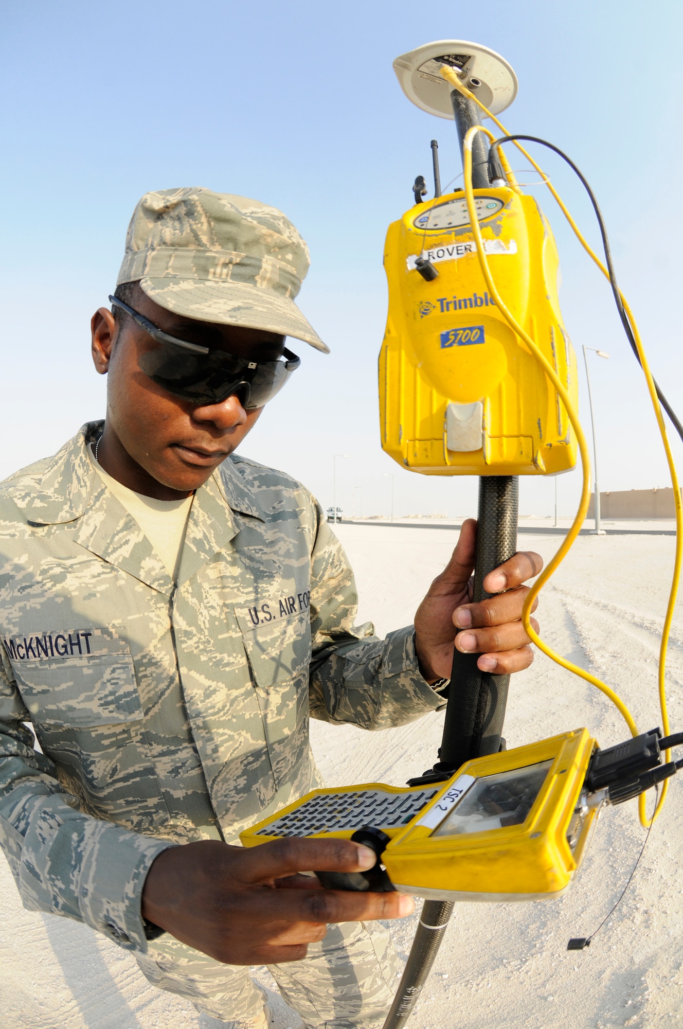 Airman 1st Class Shevanne McKnight, engineering assistant assigned to the 379th Expeditionary Civil Engineer Squadron, uses a Global Positioning System receiver to get elevation shots of the land Oct. 10, 2008, at an undisclosed air base in Southwest Asia. Airman McKnight and other engineering assistants survey land elevation so construction plans can be made. Airman McKnight, a native of Augusta. Ga., is deployed from McConnell Air Force Base, Kan., in support of Operations Iraqi and Enduring Freedom and Joint Task Force-Horn of Africa. (U.S. Air Force photo by Staff Sgt. Darnell T. Cannady/Released)