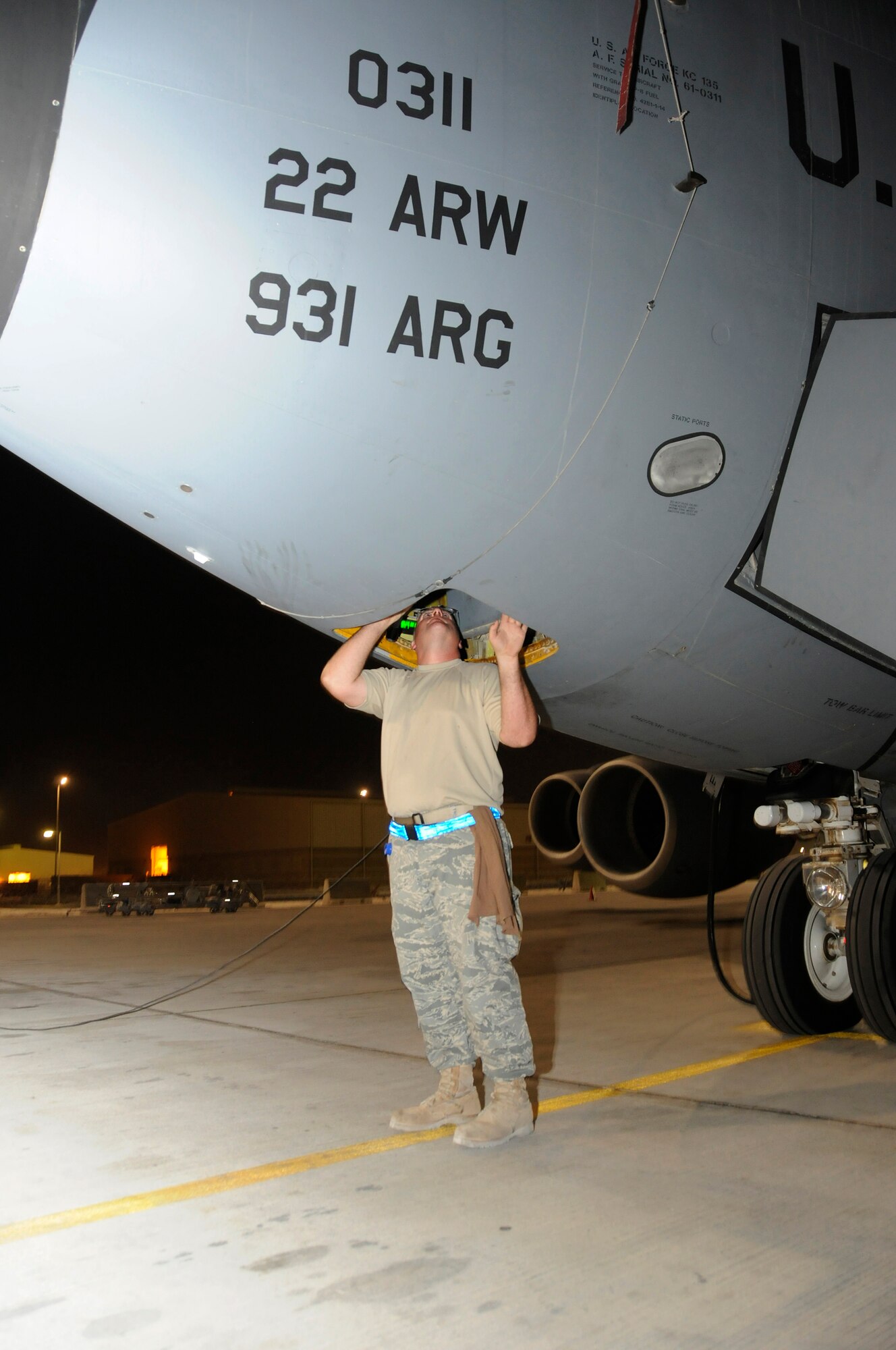 Tech. Sgt. James White, 379th Expeditionary Aircraft Maintenance Squadron, 340th Aircraft Maintenance Unit, checks the nose wheel linear actuator on a KC-135 Stratotanker as part of a pre-flight inspection October 10, 2008, at an undisclosed air base in Southwest Asia.  KC-135s provide the core aerial refueling capability for the United States Air Forces Central forces supporting Operations Iraqi and Enduring Freedom and Joint Task Force-Horn of Africa.  Sergeant White, a native of Fayetteville, N.C., is deployed from MacDill Air Force Base, Fla.  (U.S. Air Force photo by Tech. Sgt. Michael Boquette/Released)
