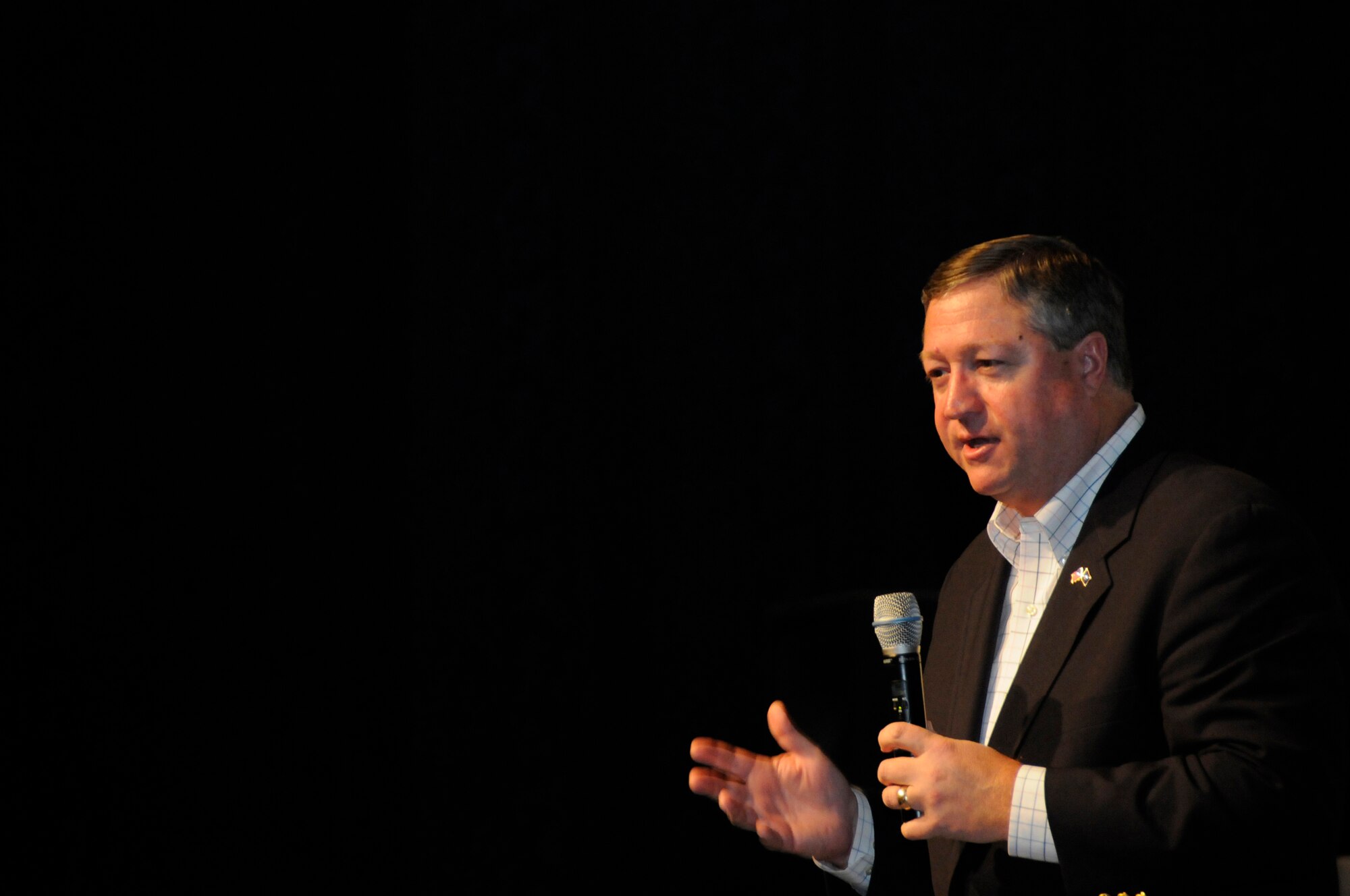 Secretary of the Air Force Michael Donley addresses an Airmen's call audience Oct. 11, 2008, during his visit to the 379th Air Expeditionary Wing.  The secretary described his vision ahead for the Air Force, the challenges faced and the plan to move the Air Force into the future.  After his presentation, the secretary opened up the floor for questions from the audience.  This is the secretary's first visit to the Air Forces Central area of responsibility.  (U.S. Air Force photo by Tech. Sgt. Michael Boquette/Released)