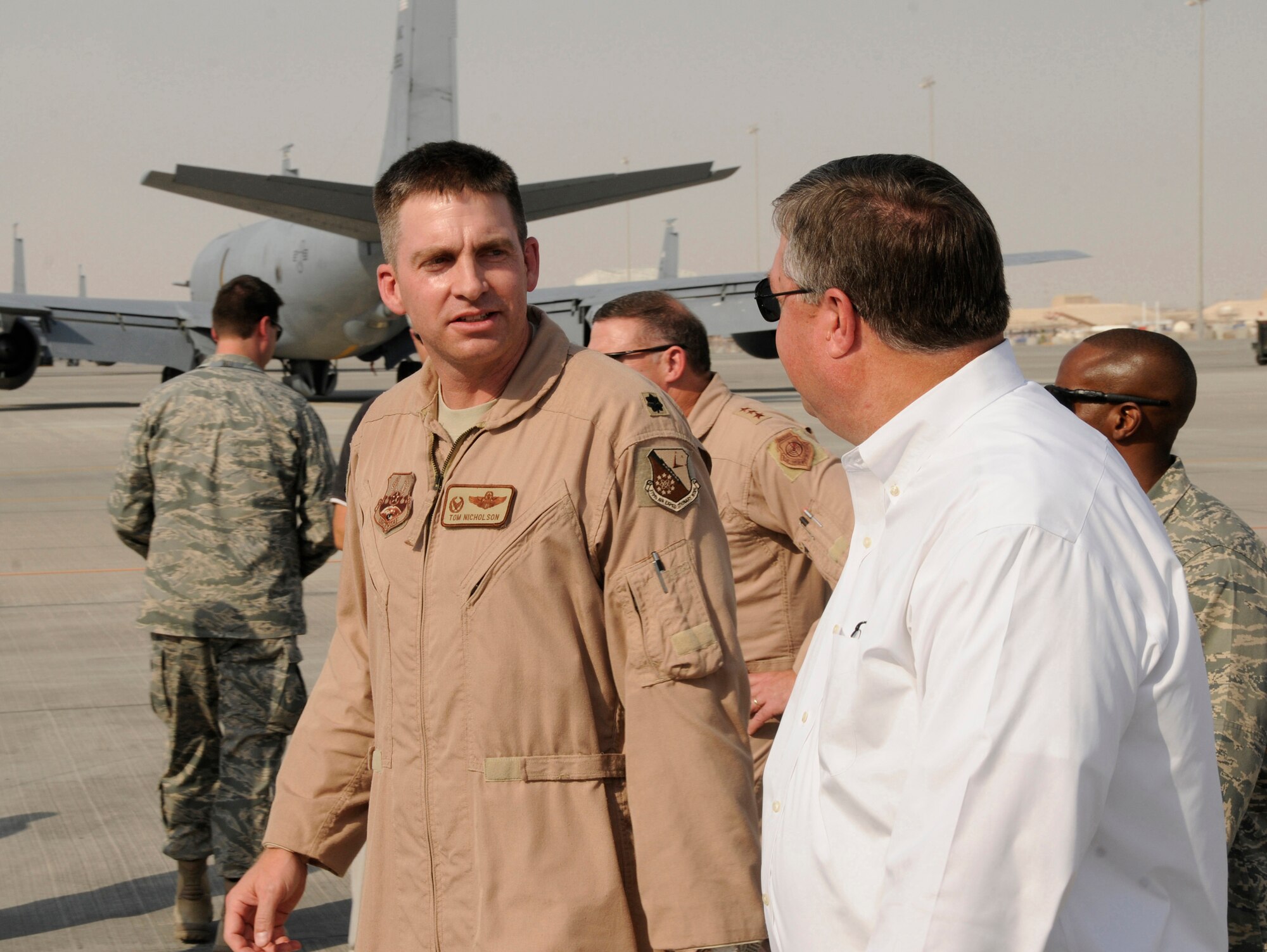 Lt. Col. Thomas Nicholson, 763rd Expeditionary Reconnaissance Squadron commander, briefs Secretary of the Air Force Michael Donley on the unique features and abilities of the RC-135 Rivet Joint, October 11, 2008.  The Secretary was briefed on the unit's mission of providing worldwide reconnaissance, real-time intelligence, command and control, information warfare and combat support.  The Secretary toured five different airframes operating from this undisclosed air base in Southwest Asia during a tour of the 379th Air Expeditionary Wing.  (U.S. Air Force photo by Tech. Sgt. Michael Boquette/Released)