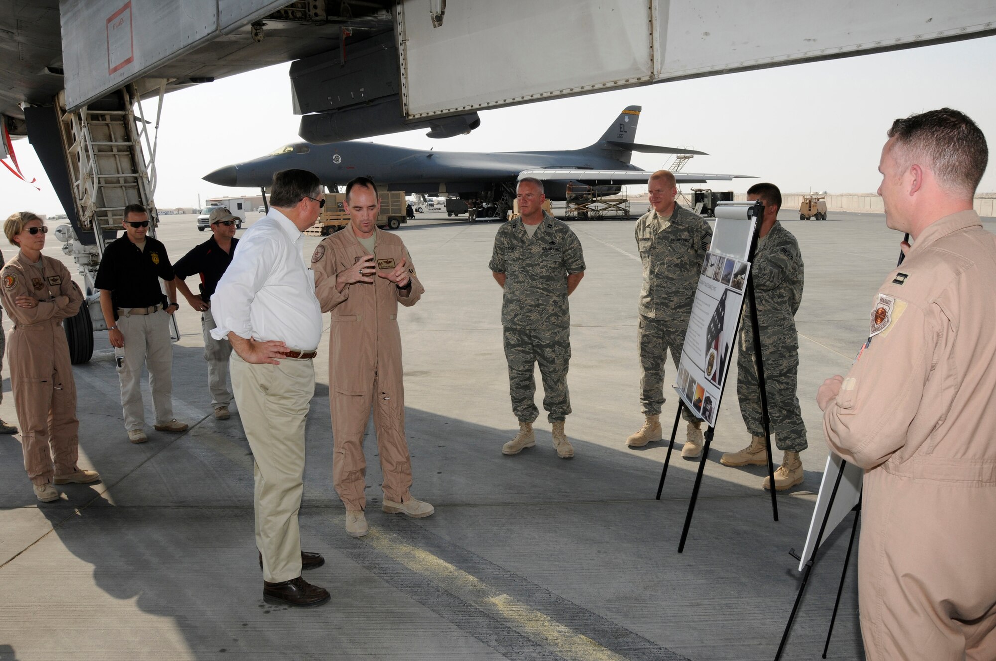Lt. Col. Kevin Kennedy, 34th Expeditionary Bomb Squadron commander, briefs Secretary of the Air Force Michael Donley on the mission capabilities of the B-1 Lancer, October 11, 2008.  The Secretary was briefed on show of force and guided munitions capabilities of the platform.  The Secretary toured five different airframes operating from this undisclosed air base in Southwest Asia during a tour of the 379th Air Expeditionary Wing.  (U.S. Air Force photo by Tech. Sgt. Michael Boquette/Released)