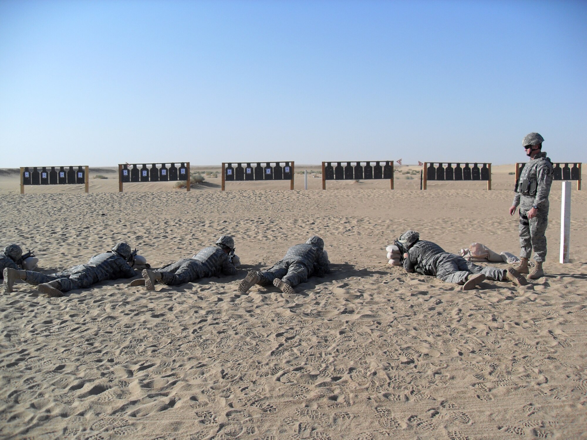 SOUTHWEST ASIA -- Master Sgt. Joseph Bennett, 386th Expeditionary Security Forces Squadron Force Protection superintendent, instructs a group of force protection Airmen during training at an air base in Southwest Asia. Force protectors perform numerous tasks while deployed to the U.S. Central Command area of responsibility, including escort duties and base project support. Sergeant Bennett is deployed from Lackland Air Force Base, Texas. 