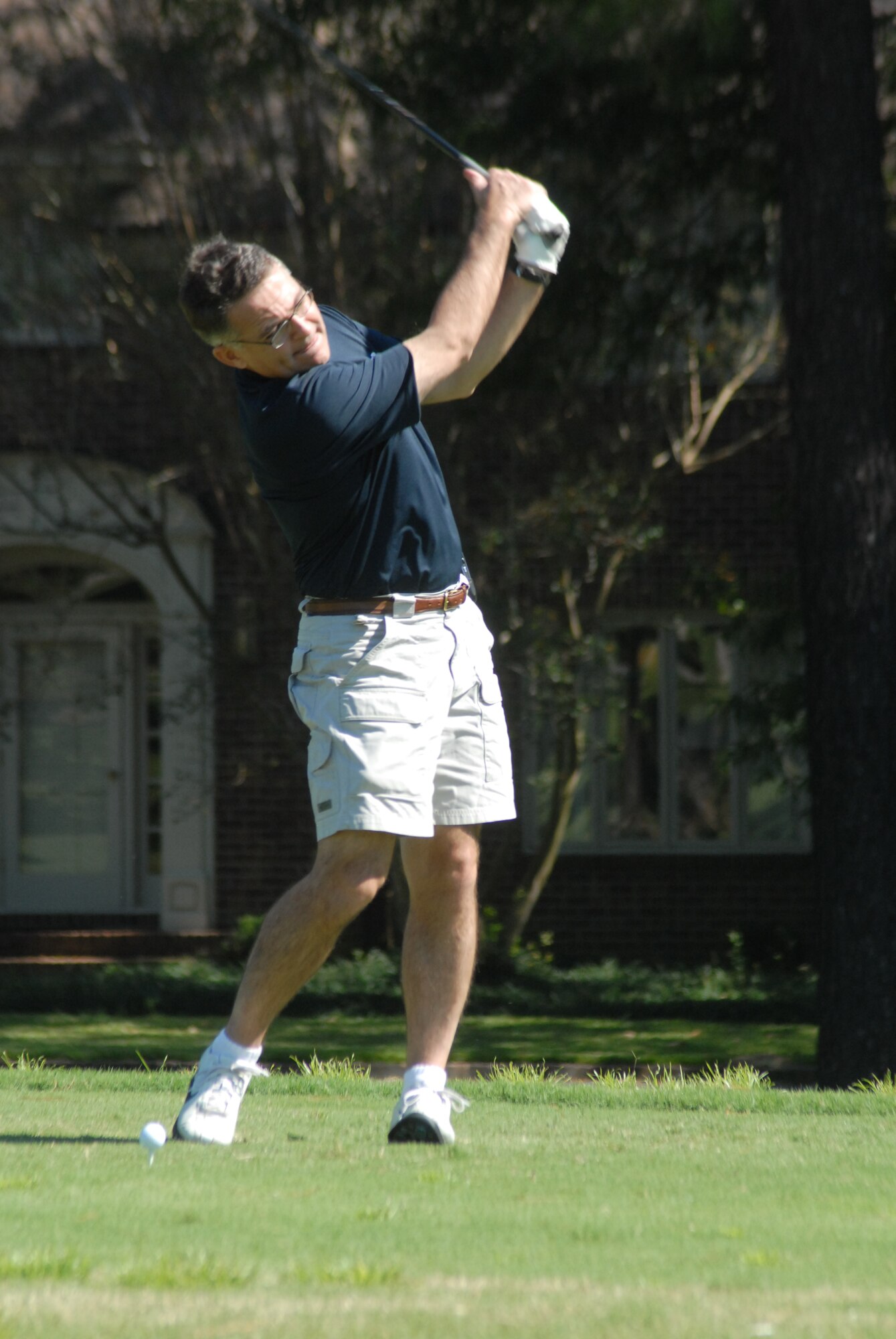 Col. John McDonald, 43rd Airlift Wing Commander, takes a practice swing before teeing off during the Honorary Commander's Golf Tournament at Chicora Country Club in Erwin, N.C. Oct. 3. (U.S. Air Force Photo by Airman 1st Class Mindy Bloem)