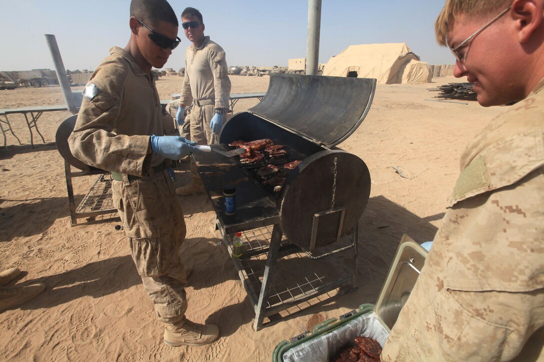 Marines with Meals on Wheels from Regimental Combat Team 7 all volunteered to come out and cook hot food for the Afghan National Army and Marines with Lima Company, 3rd Battalion, 1st Marine Regiment, in Combat Outpost Rankel, Garmsir District, Helmand province, Afghanistan, Aug. 19, 2010. The Marines with Meals on Wheels say they love coming out and providing a hot meal for the Marines at the battalions.