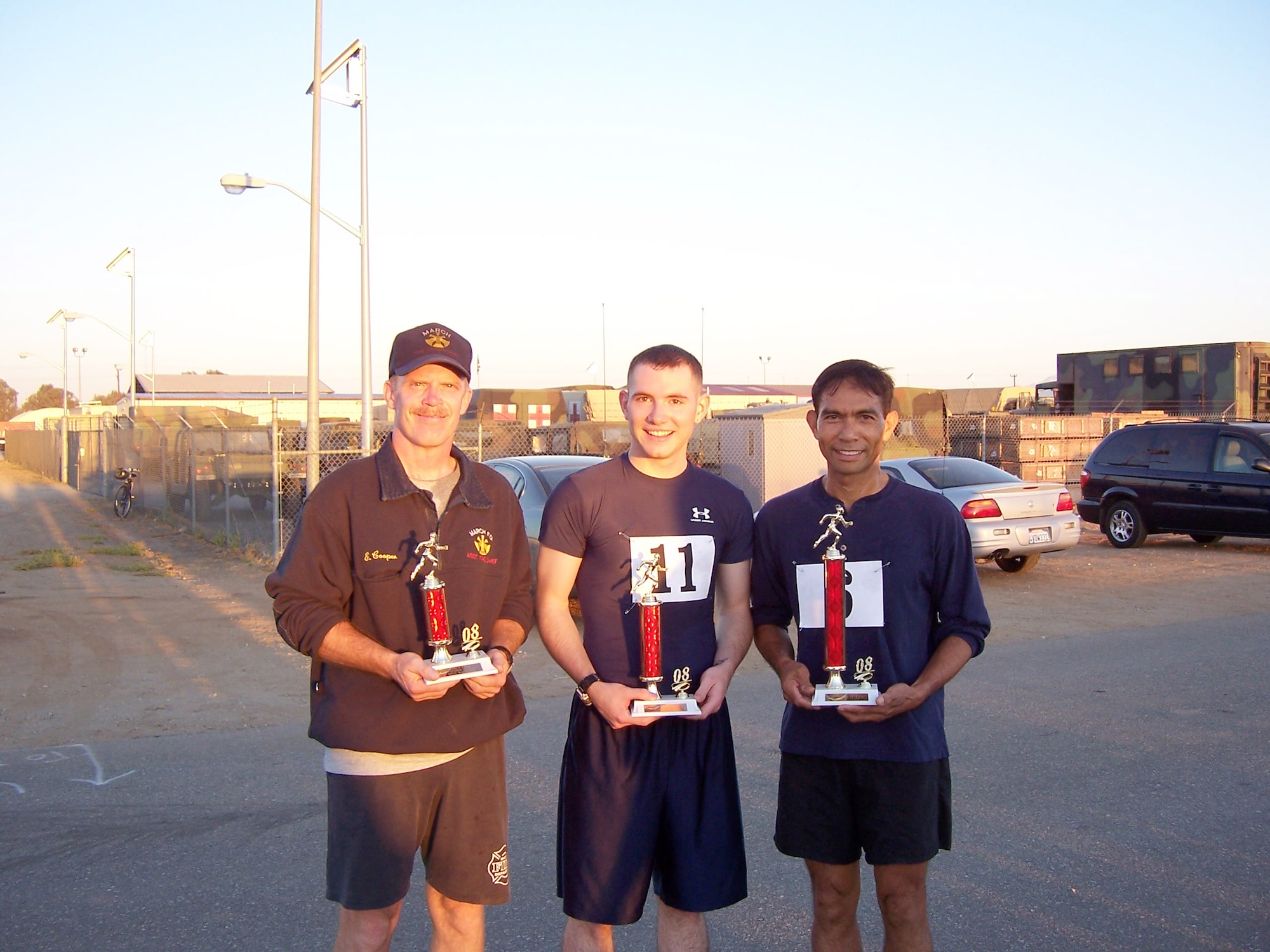 Winners of the Men’s category of the Fall-In 5K Run/Walk are: (left to right) Mike Cooper, Fire Dept., 3rd place; Jed Martin, ANG, 2nd place; and Roque Batayola, 452 AMXS, 1st place. (U.S. Air Force photo)