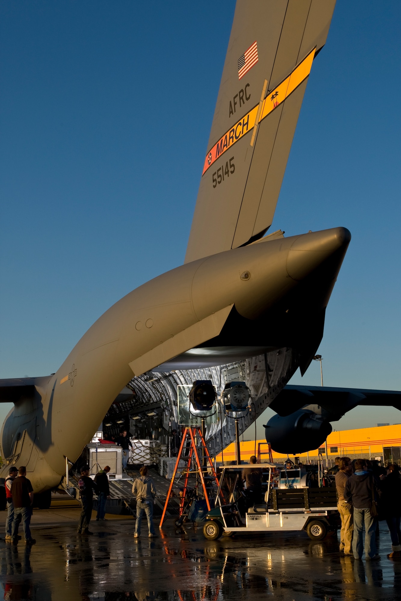More than 30 members from March participated in last weekend’s box office hit “Eagle Eye” during its filming at March ARB. Airmen, Soldiers, civilian employees and employees at the DHL distribution center at the south end of the base were all involved in various scenes. The DHL hub was used for a chase scene where the actors slid down and crawled across equipment, while military members participated as extras, posing as TSA and airport police. A C-17 aircraft was also featured. In the movie, Shia LaBeouf and co-star Michelle Monaghan are strangers thrown together in dangerous situations after they receive a phone call by a mysterious woman who threatens their lives and their families. Throughout their travels, they are watched through everyday technology and are eventually marked as terrorists who become the most wanted people in the country. (U.S. Air Force photo)