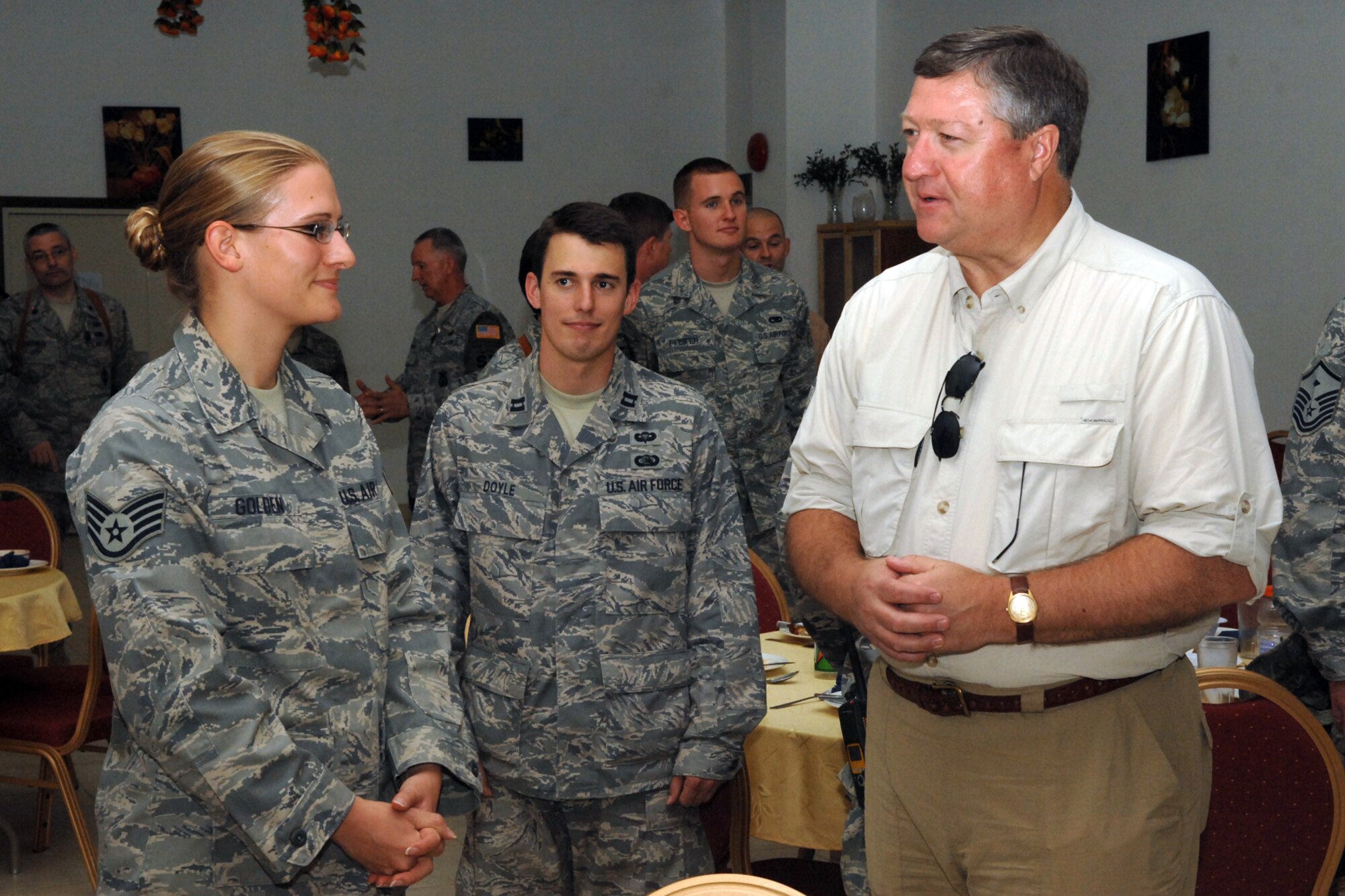 Staff Sgt. Rachel Golden, a 506th Expeditionary Communications Squadron communications technician at Kirkuk Regional Air Base, Iraq, talks to Secretary of the Air Force Michael Donley during his visit here Oct. 14.  The secretary toured various facilities and spoke to Airmen about his vision for the overall mission within the Southwest Asia AOR and the future of the Air Force.  Sergeant Golden is deployed from Spokane International Airport Geiger Field, Spokane, Wash. (U.S. Air Force photo/Senior Airman Randi Flaugh)