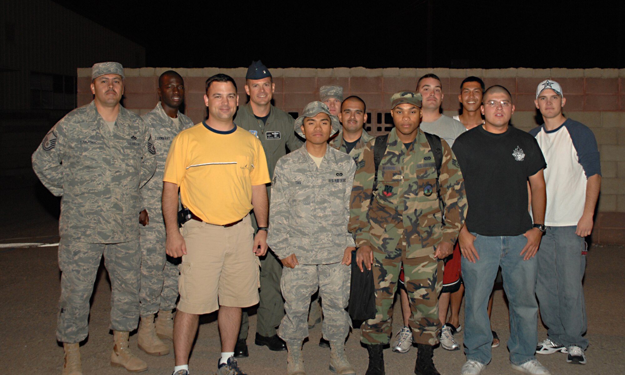 Senior Airman Ralph Lauren Tan, 49th Civil Engineer Squadron, poses with members of his squadron at Holloman Air Force Base, N.M., October 8. Airman Tan was deployed for five months to Camp Speicher, Iraq with the 823rd Rapid Engineers Deployable Heavy Operations Repair Squadron Engineers. (U.S. Air Force photo/ Senior Airman Tiffany Trojca)