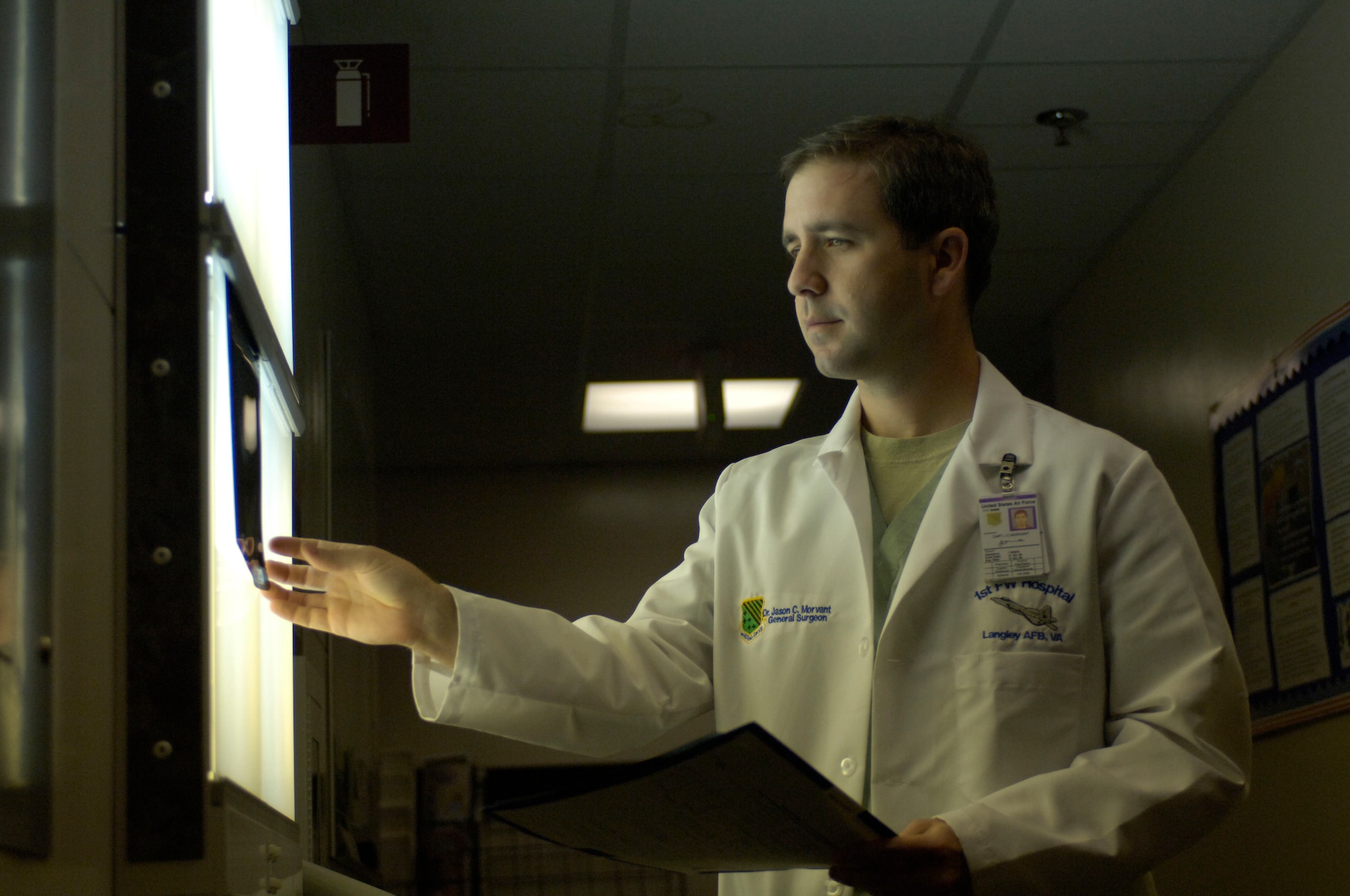 LANGLEY AIR FORCE BASE, Va. -- Maj. Jason Morvant, chief of surgery at the 1st Fighter Wing Hospital, examines mammogram films.  Annual mammograms are key in helping doctors detect and diagnose breast cancer in patients.  Both annual mammograms and monthly self-breast examinations play important roles in prevention and early detection of the disease. (U.S. Air Force photo/Airman 1st Class Sylvia Olson)