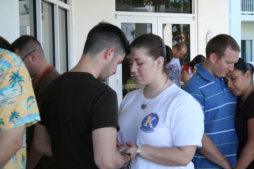 Senior Airman Steven Hammond, 71st Rescue Squadron airborne mission system specialist, and wife, Kaylee, hold hands during a marriage retreat class. The class focused on strengthening marriage ties. (Courtesy photo)