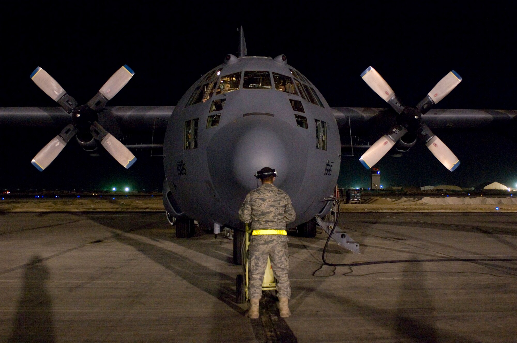 Staff Sgt. Alex Rosales prepares to launch an EC-130H Compass Call Oct. 6 at Bagram Airfield, Afghanistan. It took 80,000 maintenance hours to help the 41st Expeditionary Electronic Attack Squadron members to fly more than 10,000 combat hours in support of Operation Enduring Freedom. Sergeant Rosales is a crew chief for the 41st Expeditionary Electronic Attack Squadron. (U.S. Air Force photo/Staff Sgt. Rachel Martinez) 
