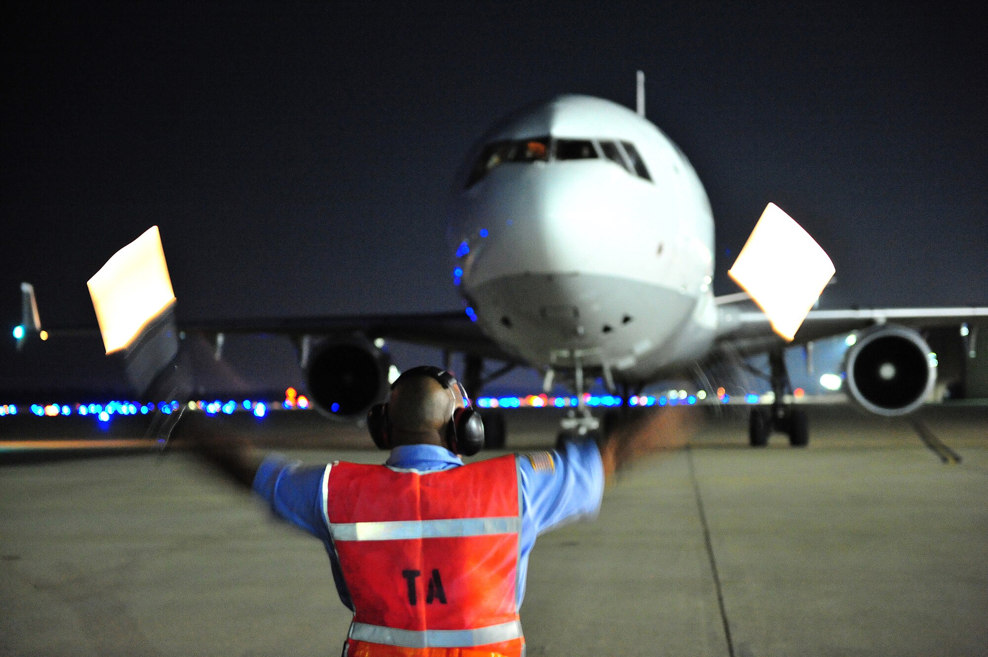 SHAW AIR FORCE BASE, S.C. --  A passenger jet carrying approximately 340 Airmen is directed to its parking slot Oct. 13. The Airmen, from various squadrons, returned from a four-month deployment to Southwest Asia where they supported the Global War on Terror. (U.S. Air Force photo/Tech. Sgt. Josef Cole)