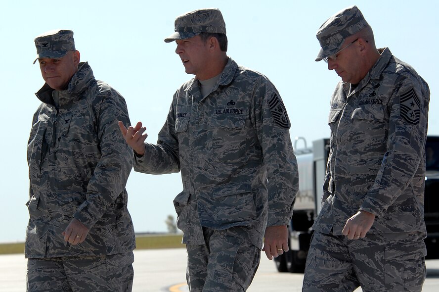 MINOT AIR FORCE BASE, N.D. -- Chief Master Sgt. of the Air Force Rodney J. McKinley (center) talks with Col. Joel Westa (left), 5th Bomb Wing commander, and  Chief Master Sgt. Mark Clark (right), 5th BW command chief master sergeant, upon arriving here Oct. 8. Chief McKinley’s three-day visit marks his first trip to Minot AFB as CMSAF to meet Airmen from the 5th BW and the 91st Missile Wing. Chief McKinley is the 15th chief master sergeant appointed to the highest noncommissioned officer position in the Air Force. (U.S. Air Force photo by Senior Airman Kelly Timney)