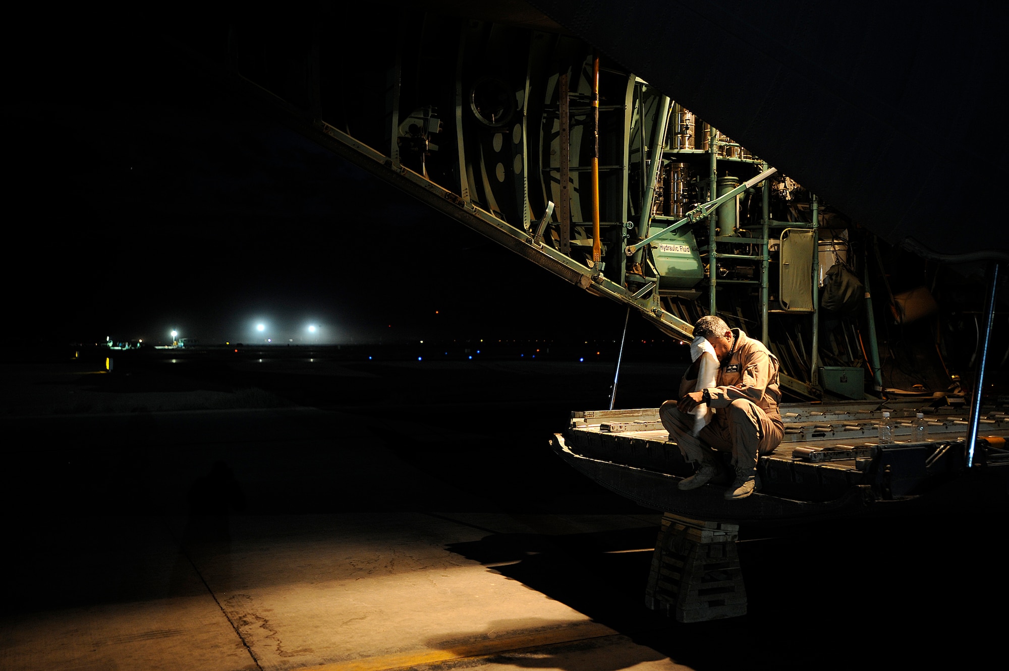 An Iraqi airman waits for cargo for a C-130 aircraft Oct. 11 at Joint Base Balad, Iraq. The Iraqi airman was on a cargo resupply mission with members of the U.S. Air Force 370th Air Expeditionary Advisory Squadron. He is assigned to the 23rd Squadron, which operates three C-130s used for transporting troops, supplies and distinguished visitors. (U.S. Air Force photo/Airman 1st Class Jason Epley) 

