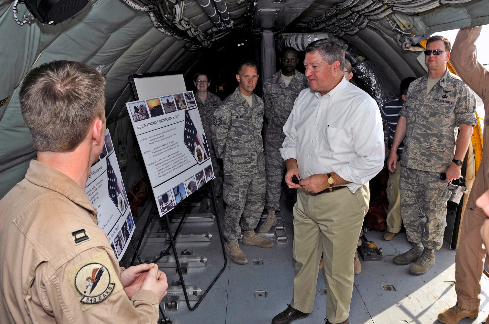 Capt. James Blech briefs mission capabilities to Secretary of the Air Force Michael B. Donley Oct. 11 at a Southwest Asia air base. The secretary toured five different airframes at the base. Captain Blech is the 340th Expeditionary Air Refueling Squadron assistant director of operations. (U.S. Air Force photo/Tech. Sgt. Michael Boquette) 
