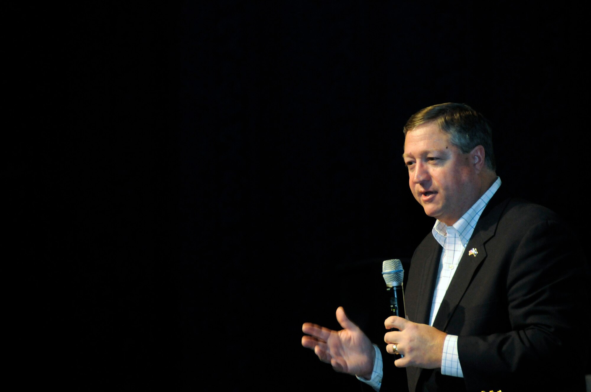 Secretary of the Air Force Michael B. Donley addresses an Airmen's call audience during his visit to the 379th Air Expeditionary Wing Oct. 11 at an air base in Southwest Asia. The secretary described his vision ahead for the Air Force, the challenges faced and the plan to move the Air Force into the future. (U.S. Air Force photo/Tech. Sgt. Michael Boquette) 
