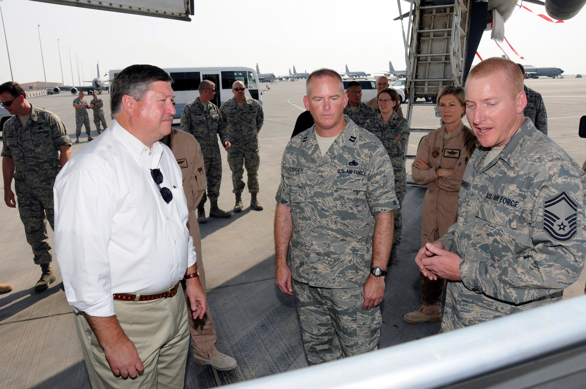 Senior Master Sgt. David Egermier (right) explains B-1B Lancer maintenance procedures to Secretary of the Air Force Michael B. Donley (left) Oct. 11 at a Southwest Asia air base. Sergeant Egermier, along with Capt. Christopher Glidden briefed on the work required to keep aircraft mission ready. The secretary toured five different airframes at the base. Sergeant Egermier and Captain Glidden are assigned to the 379th Expeditionary Aircraft Maintenance Squadron. (U.S. Air Force photo/Tech. Sgt. Michael Boquette) 
