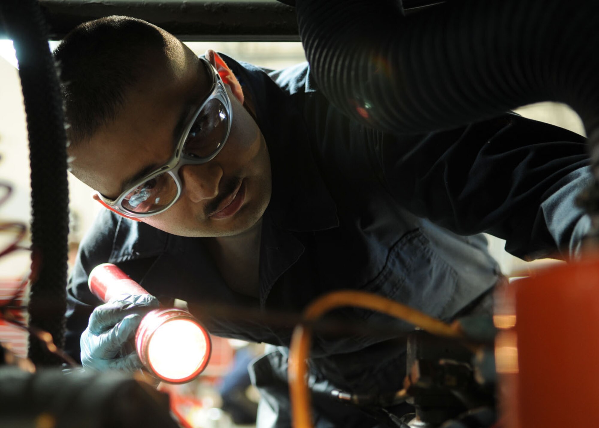 Senior Airman Victor Portillo, 100th Maintenance Squadron aerospace ground equipment journeyman, checks electrical wires for damage on a NF-2D floodlight during scheduled inspections Oct. 9, 2008, at RAF Mildenhall, England. The aerospace ground equipment section takes care of all scheduled inspections, maintenance repairs, and overall serviceability of each individual piece of powered and non-powered AGE equipment. (U.S. Air Force photo by Staff Sgt. Jerry Fleshman)