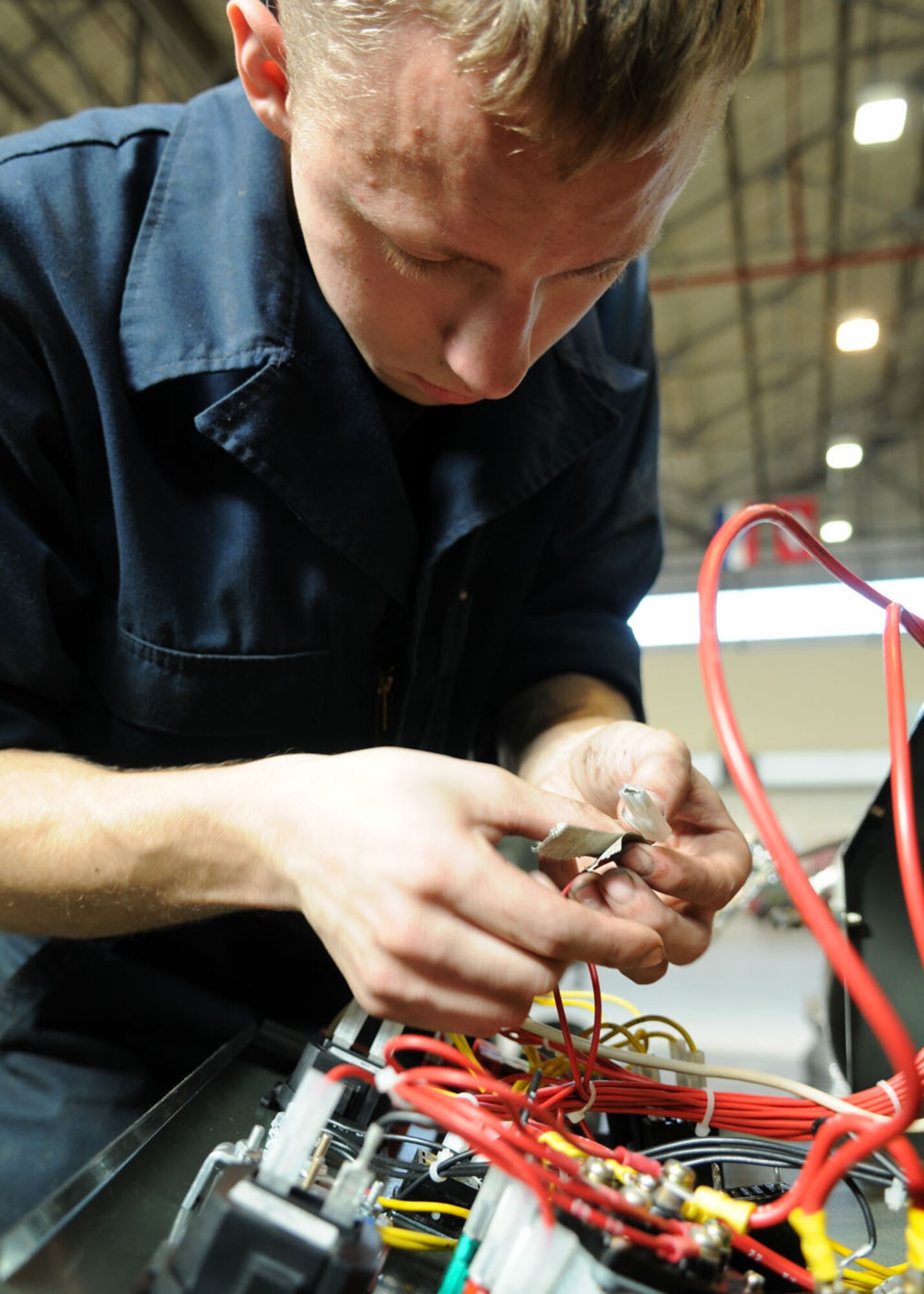 Airman 1st Class Andrew Dore’, an aerospace ground equipment technician from the 100th Maintenance Squadron labels wires while performing an inspection Oct. 9, 2008 at RAF Mildenhall, England, on an AN/M32A-86D which supplies aircraft with electrical power. Aerospace ground equipment section takes care of all scheduled inspections, maintenance repairs, and overall serviceability of each individual piece of powered and non-powered AGE equipment. (U.S. Air Force photo by Staff Sgt. Jerry Fleshman)