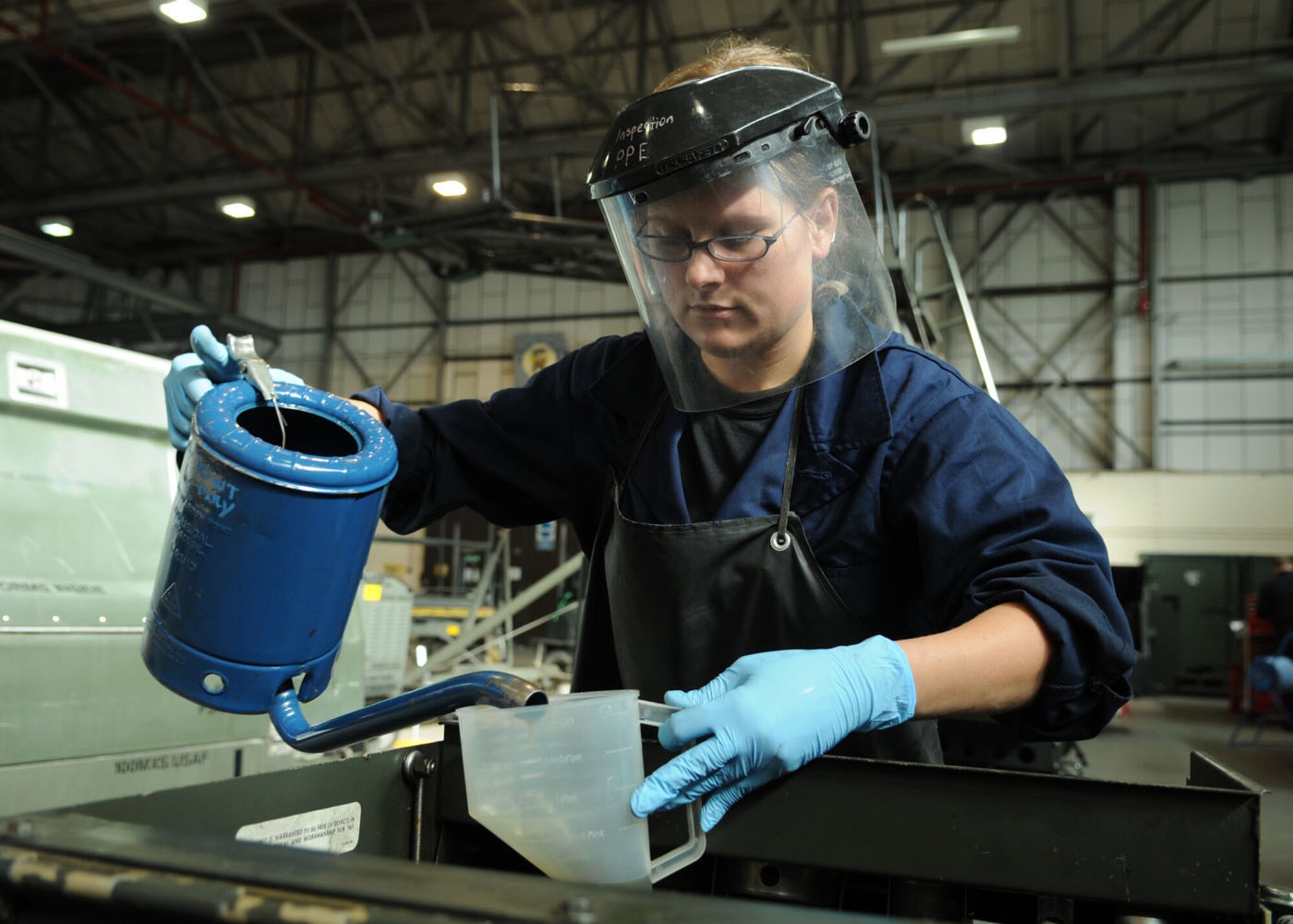 Senior Airman Cassandra Wait, a 100th Maintenance Squadron aerospace ground equipment journeyman, performs service on a MC-2A which provides air pressure for pneumatic tools on Oct. 9, 2008, RAF Mildenhall, England. Aerospace ground equipment section takes care of all scheduled inspections, maintenance repairs, and overall serviceability of each individual piece of powered and non-powered AGE equipment. (U.S. Air Force photo by Staff Sgt. Jerry Fleshman)