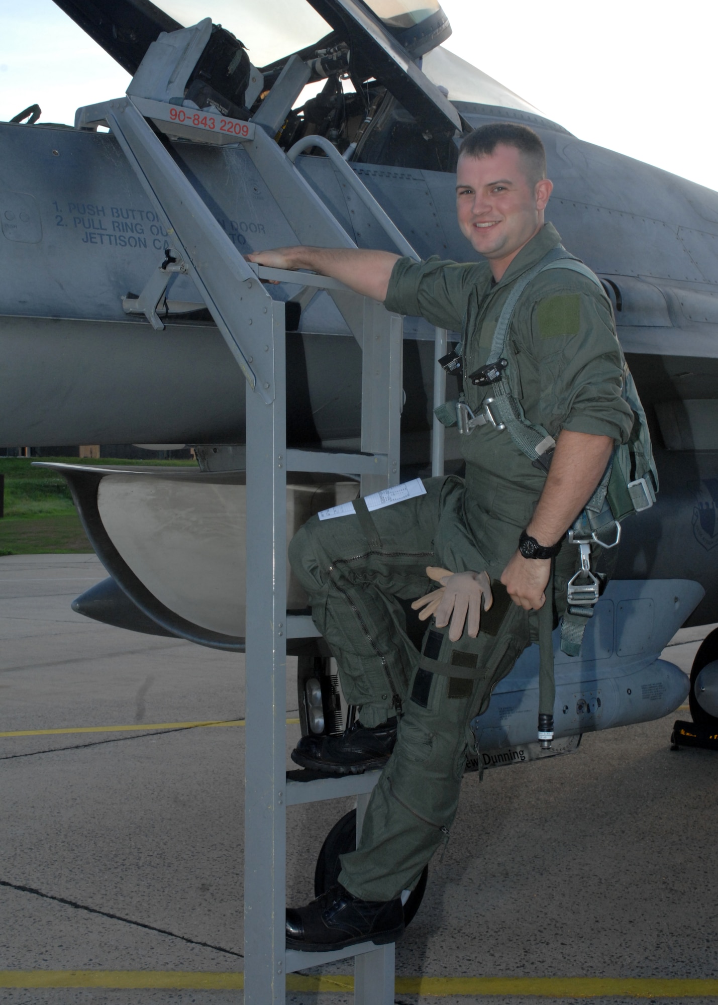 SPANGDAHLEM AIR BASE, Germany -- Senior Airman Corey Mills, 52nd Air Maintenance Squadron, 22nd Fighter Squadron crew chief, receives an incentive flight in an F-16 Fighting Falcon August 22, 2008. Airman Mills received an incentive flight for his many accomplishments as the Squadron Airman of the Year, Distinguished Airman of the Week, while deployed, and receiving Senior Airman Below the Zone. (U.S. Air Force photo by Airman 1st Class Jenifer H. Calhoun)
