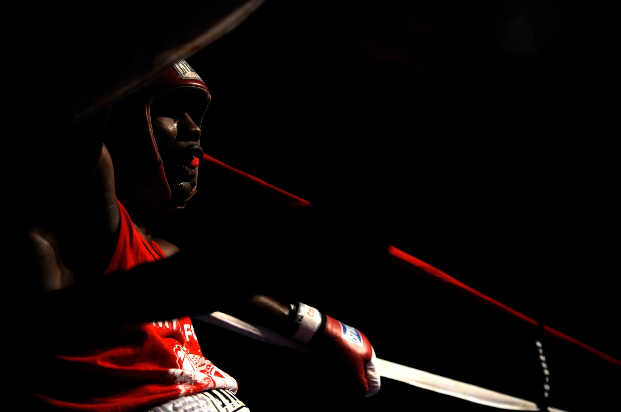 United States Air Force Staff Sgt. Harold Davis, 86th Maintenance Squadron, rest during a boxing match against Denis Heier, a German boxer from the Turngemeinde Worms boxing club, Vogelweh Air Base, Germany, Oct. 11, 2008. Heier defeated Staff Sgt. Davis. (U.S. Air Force photo by Staff Sgt. Sarayuth Pinthong)(Released)