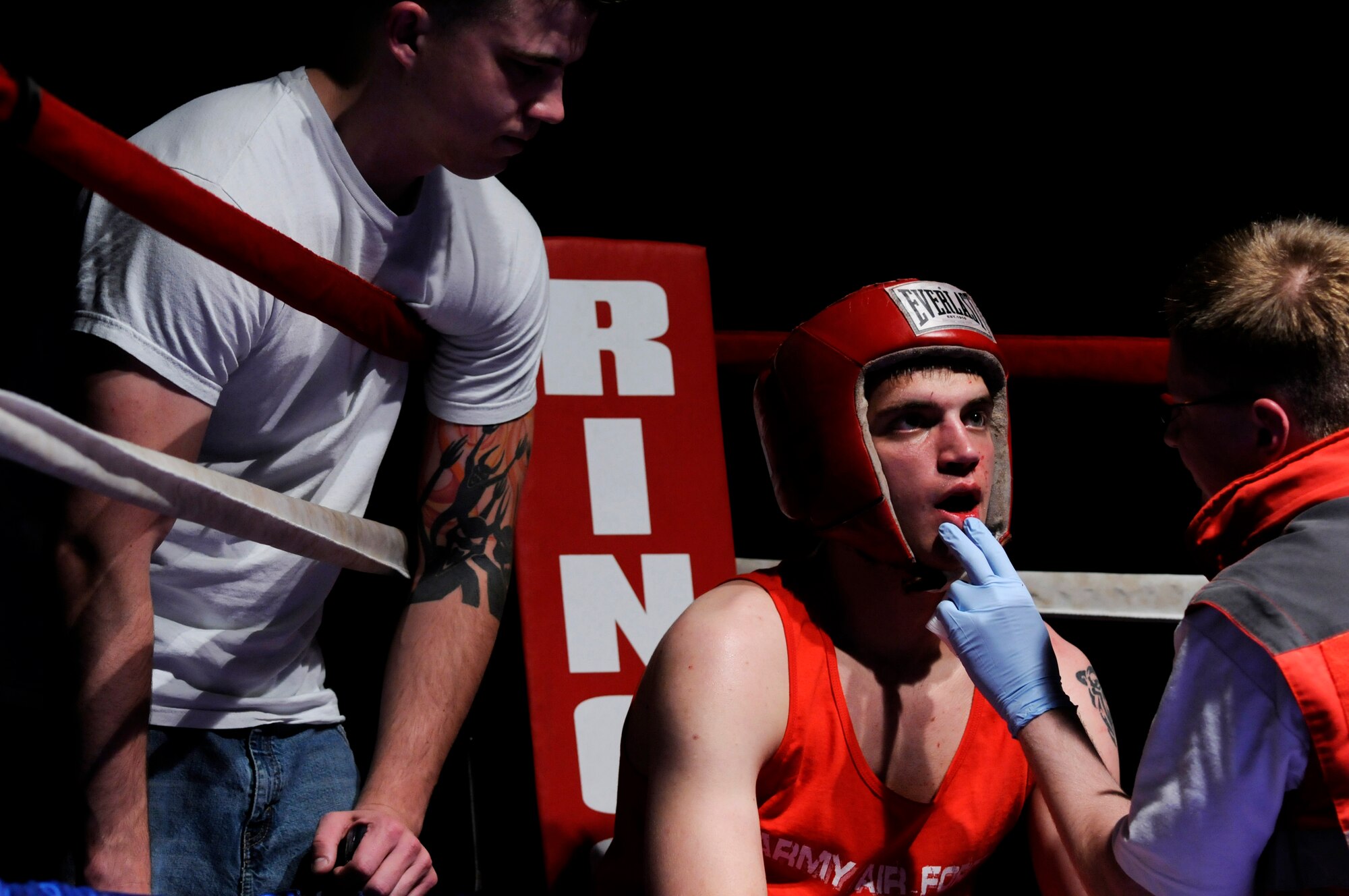 United States Air Force Airman 1st Class Matthew Tubbs, 21st Operations Weather Squadron, Sembach Annex, is checked by medics during a boxing match, Vogelweh Air Base, Germany, Oct. 11, 2008. Airman 1st Class Tubbs was defeated by 2nd Lt. Phil Menagh, 435th Aerospace Medical Squadron, Ramstein Air Base. (U.S. Air Force photo by Staff Sgt. Sarayuth Pinthong)(Released)