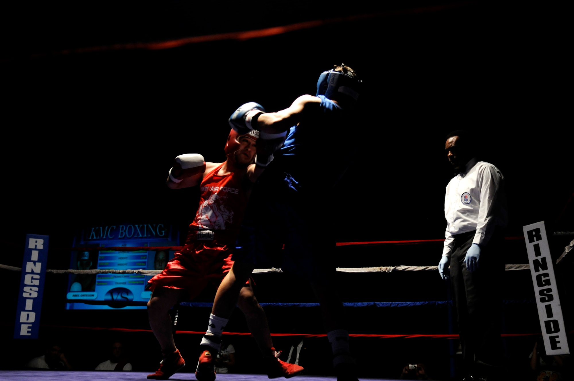 United States Army Pfc. Abel Ortegon (red trunks), Aurvey Division, Shape, Belgium, competes against Vitali Frei (blue trunks), a German boxer from the Turngemeinde Worms Boxing Club, Vogelweh Air Base, Germany, Oct. 11, 2008. Frein defeated Pfc. Ortegon. (U.S. Air Force photo by Staff Sgt. Sarayuth Pinthong)(Released)