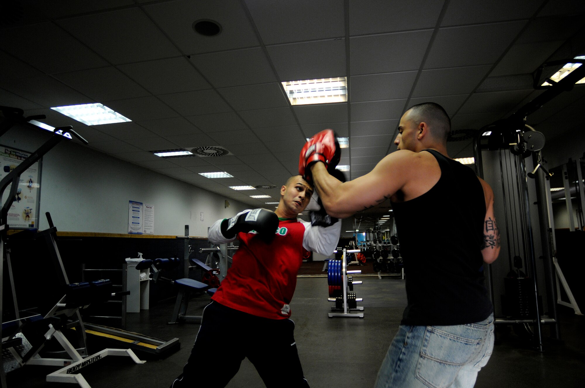 United States Army Pfc. Abel Ortegon, Aurvey Division, Shape, Belgum, warms up with Spc. Ray Rodriquez, Dental Clinic, Shape, Belguim, prior to a boxing match, Vogelweh Air Base, Germany, Oct. 11, 2008. Vitali Frei, a German boxer from the Turngemeinde Worms Boxing Club, defeated Pfc. Ortegon. (U.S. Air Force photo by Staff Sgt. Sarayuth Pinthong)(Released)