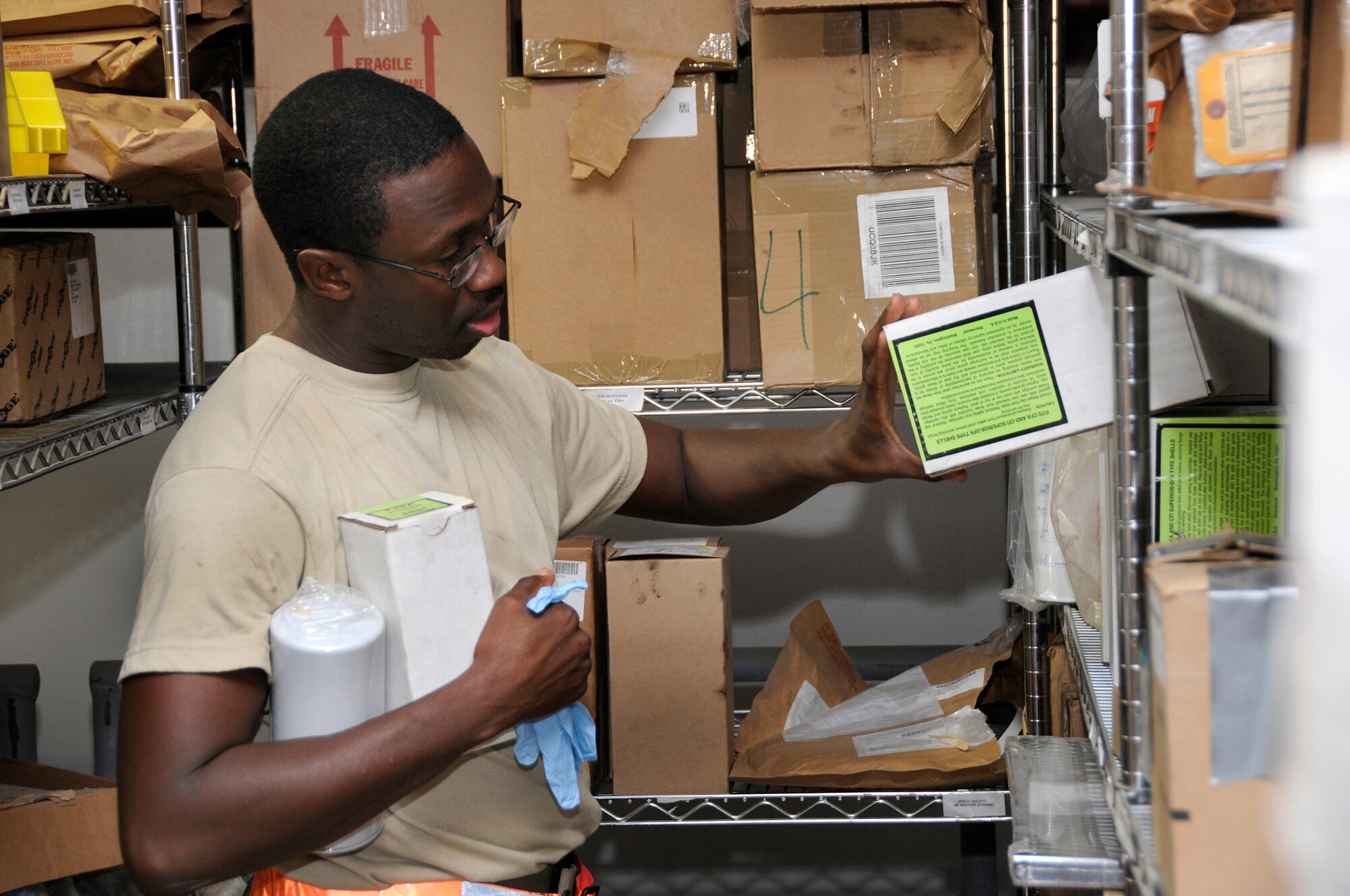 Senior Airman Scott Johnson, 379th Expeditionary Aircraft Maintenance Squadron, Aerospace Ground Equipment shop, pulls filters in preparation for a phase 2 inspection on an air conditioning/heating unit, October 13, 2008, at an undisclosed air base in Southwest Asia.  A phase 2 is an in-depth inspection checking each system on the unit, including changing out all filters and fluids.  In the desert heat, air conditioning units are mission essential because without them aircraft components would overheat during pre-flight operation checks.  Airman Johnson is a native of Warner Robins, Ga., and is deployed from Kadena Air Base, Japan, in support of Operations Iraqi and Enduring Freedom and Joint Task Force-Horn of Africa.  (U.S. Air Force photos by Tech. Sgt. Michael Boquette/Released)