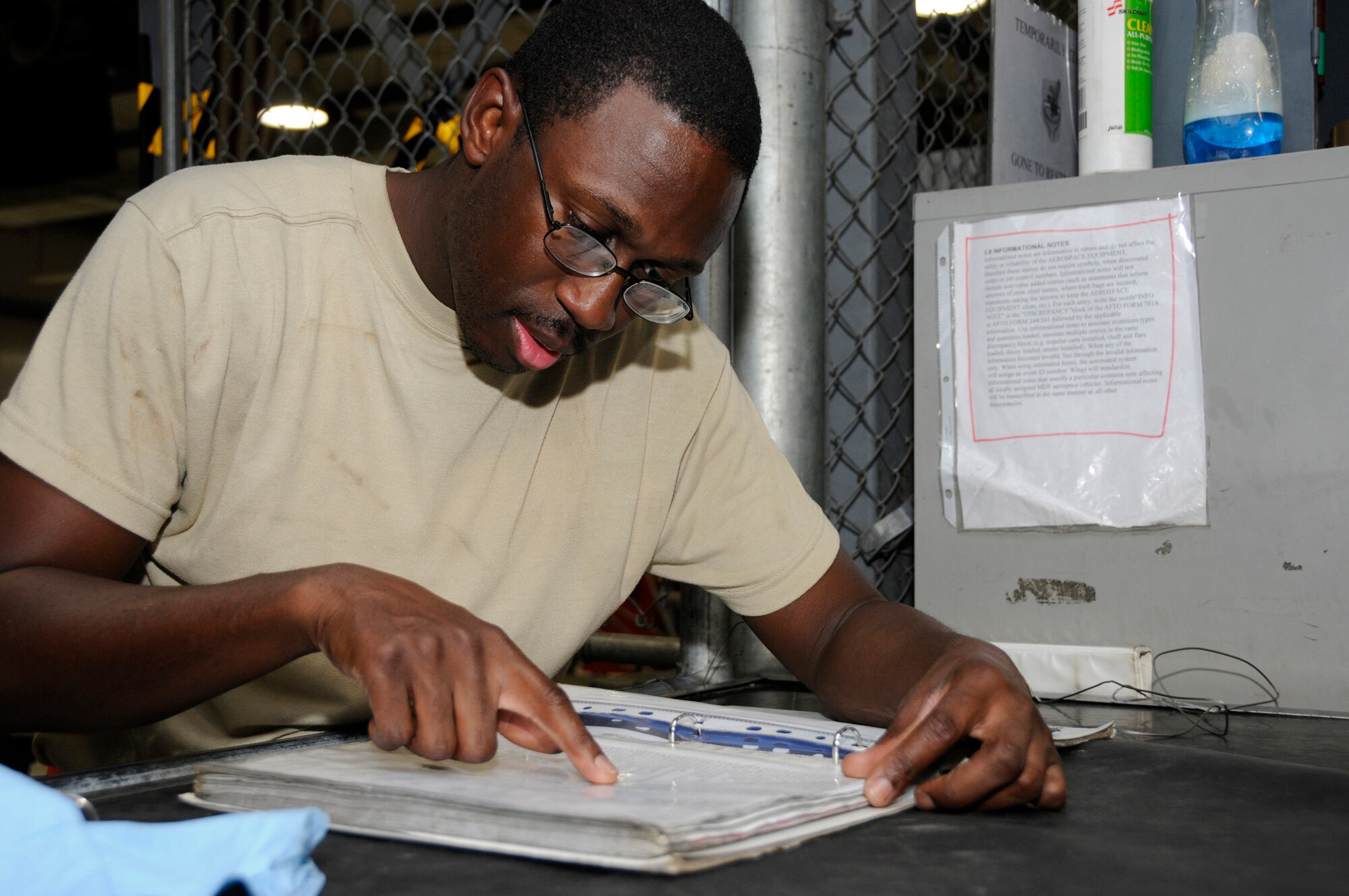 Senior Airman Scott Johnson, 379th Expeditionary Aircraft Maintenance Squadron, Aerospace Ground Equipment shop, reviews locations of each filter needed for a phase 2 inspection, October 13, 2008.  Knowing the location of each filter saves time as each filter is pulled from the shelf in preparation for a complete filter change on an air conditioning/heating unit at an undisclosed air base in Southwest Asia.  A phase 2 is an in-depth inspection checking each system on the unit, including changing out filters and all fluids.  In the desert heat, air conditioning units are mission essential because without them aircraft components would overheat during pre-flight operation checks.  Airman Johnson is a native of Warner Robins, Ga., and is deployed from Kadena Air Base, Japan, in support of Operations Iraqi and Enduring Freedom and Joint Task Force-Horn of Africa.  (U.S. Air Force photos by Tech. Sgt. Michael Boquette/Released)
