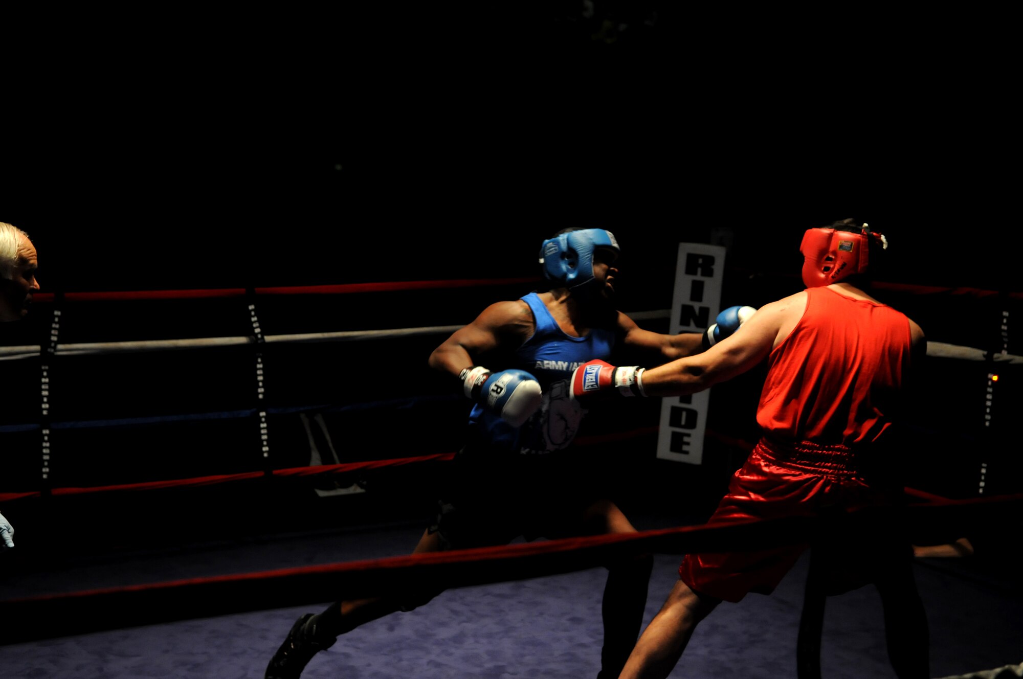 United States Air Force Tech. Sgt. John Williams (red trunks), AFTAC/DET 319, Ramstein Air Base, competes during a boxes match against U.S. Army Spc. Antonio Feagins (blue trunks), 406th Maintenance, Kaiserslautern, at Vogelweh Air Base, Oct. 11, 2008. Tech. Sgt. was defeated by U.S. Army Spc. Feagins who boxes with the Heidelberg Boxing Gymnasium. (U.S. Air Force photo by Airman 1st Class Grovert Fuentes-Contreras)(Released)