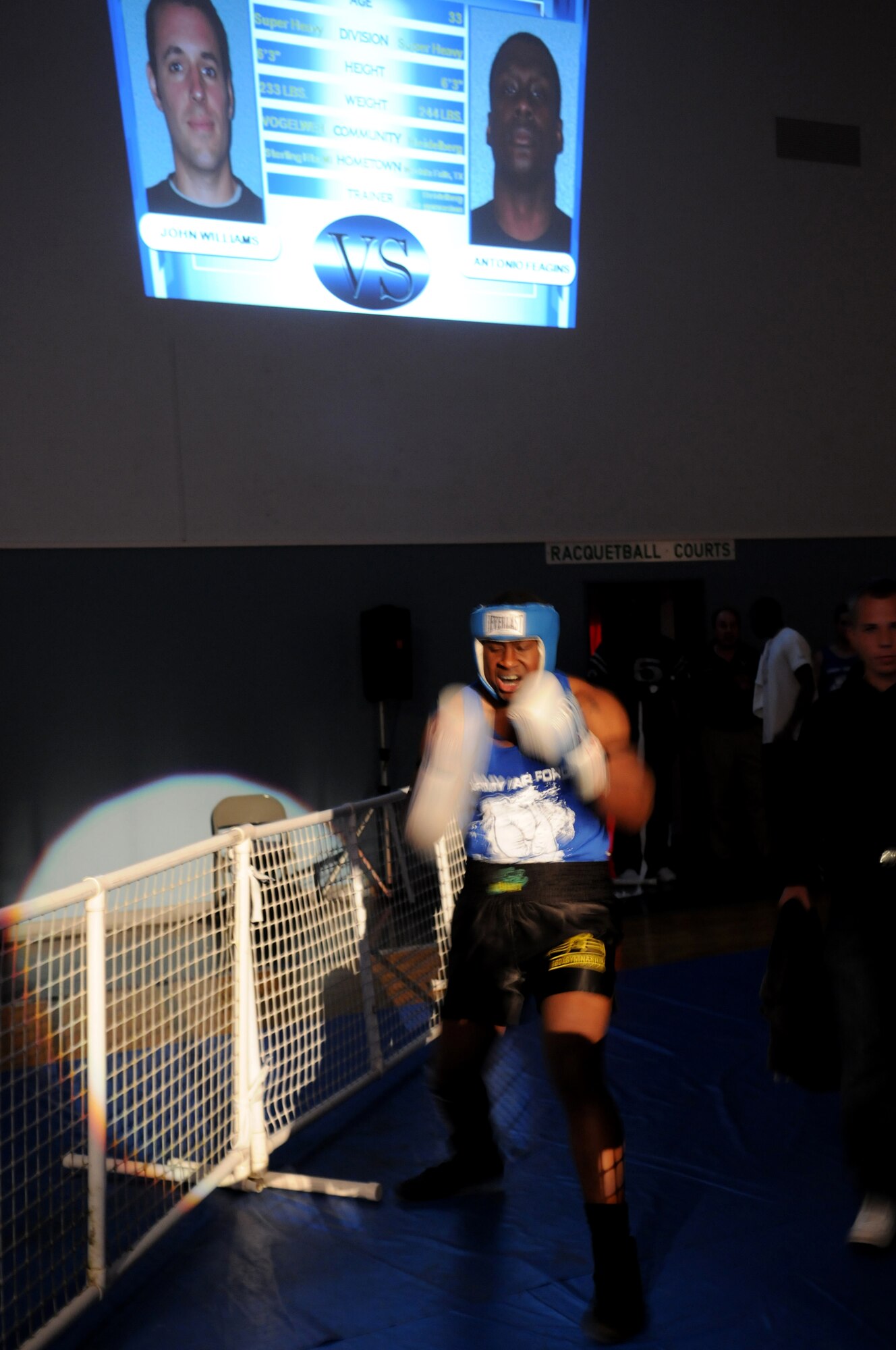 United States Army Spc. Antonio Feagins, 406th Maintenance, Kaiserslautern, enters the ring for his boxing match at Vogelweh Air Base, against U.S. Air Force Tech. Sgt. John Williams, AFTAC/DET 319, Ramstein Air Base, Oct. 11, 2008. Tech. Sgt. was defeated by U.S. Army Spc. Feagins who boxes with the Heidelberg Boxing Gymnasium. (U.S. Air Force photo by Airman 1st Class Grovert Fuentes-Contreras)(Released)