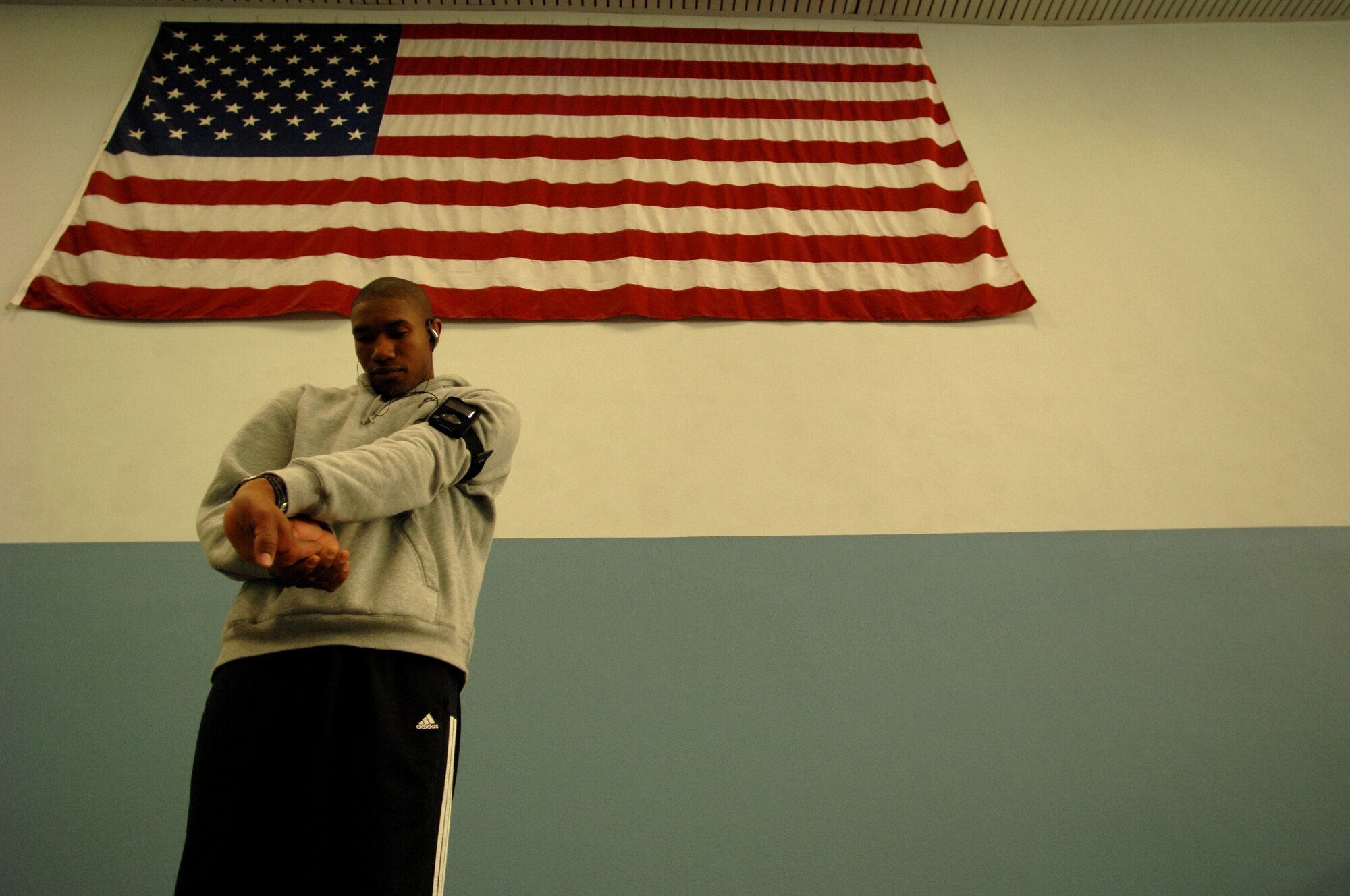 United States Air Force Staff Sgt. Harold Davis, 86th Maintenance Squadron, Ramstein Air Base, stretches and warms up prior to his boxing match, Vogelweh Air Base, Germany, Oct. 11, 2008. Staff Sgt. Davis lost his match against Denis Heier, a German boxer from the Turngemeinde Worms boxing club. (U.S. Air Force photo by Senior Airman Amber Bressler)(Released)