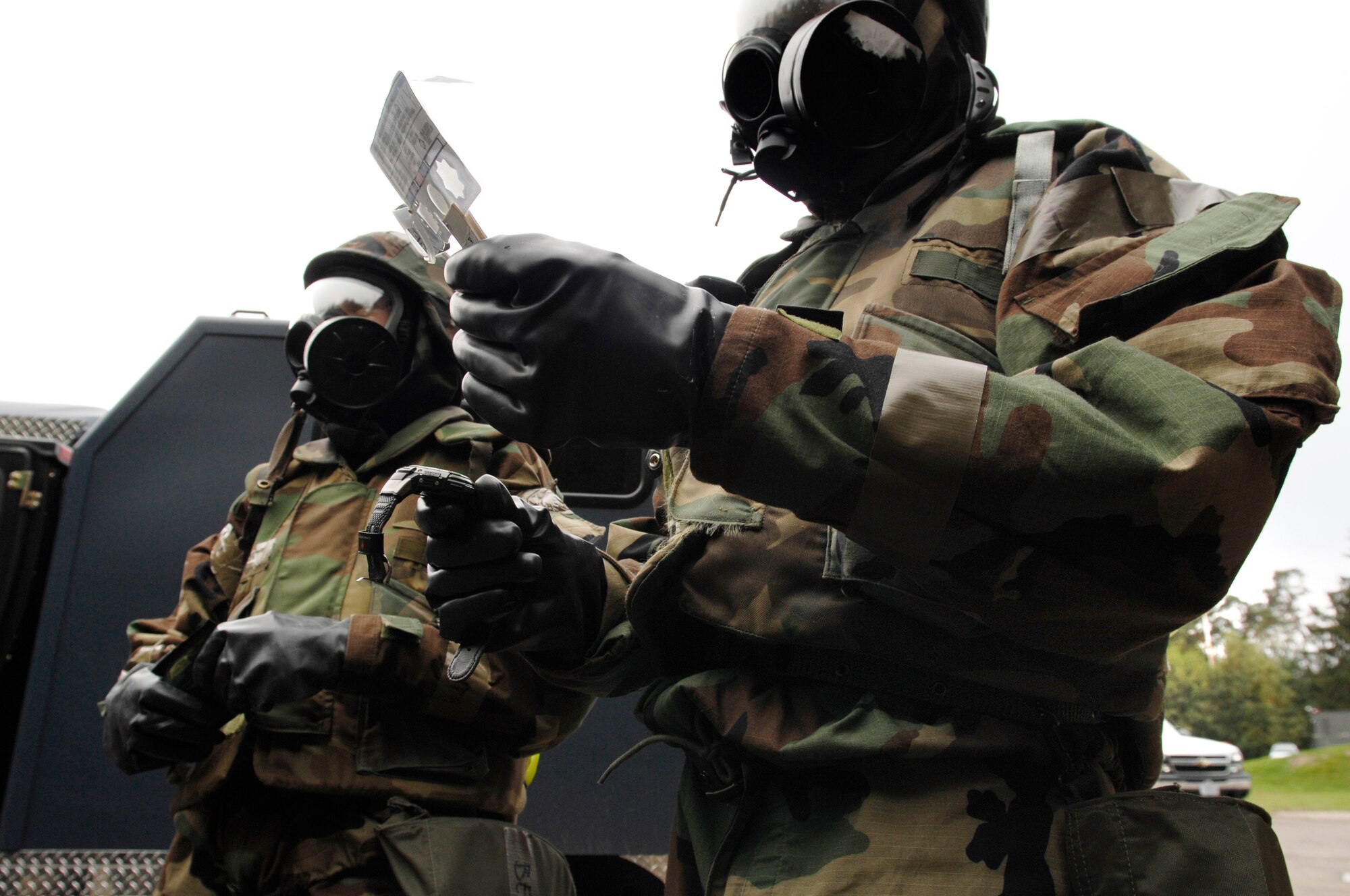 United States Air Force Senior Airman Heather Berringer (left) and Staff Sgt. William Montes, 31st Civil Engineer Squadron emergency management, Aviano Air Base, Italy, assess the surroundings for chemical warfare agents in support of the Silver Flag exercise 09-01, Ramstein Air Base, Germany, Oct. 9, 2008. Silver Flag provides expeditionary combat support training to Airmen in the civil engineer, personnel services, contracting and services career fields, preparing them for upcoming deployments. (U.S. Air Force photo by Senior Airman Amber Bressler)(Released)*