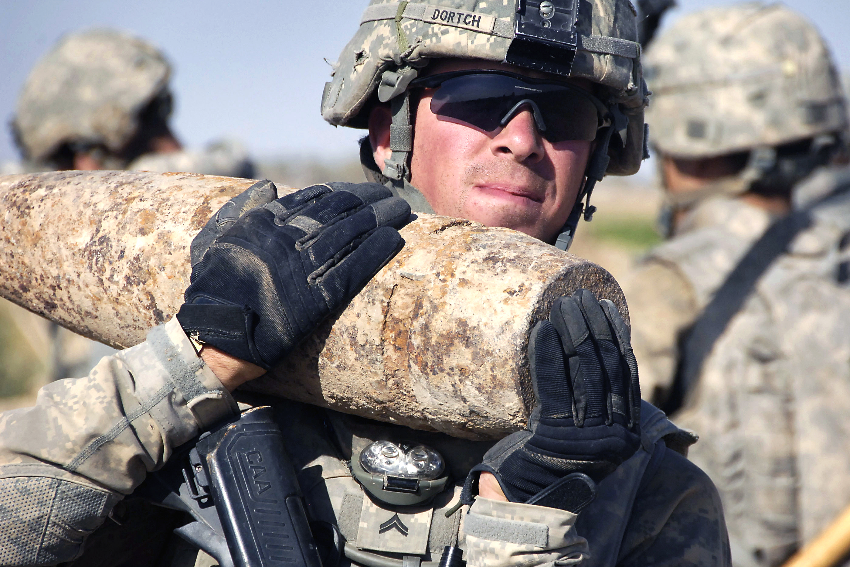 U.s. Army Cpl. Matthew Dortch Carries A Mortar Round Along With Others For  Disposal During Operation