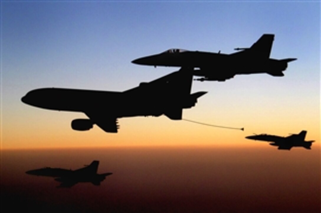 Several F/A-18 Hornets from the aircraft carrier USS Ronald Reagan await refueling with a British Royal Air Force L-1011 tanker aircraft in southern Afghanistan, Oct. 9, 2008. The Hornets provide support to coalition forces on the ground.