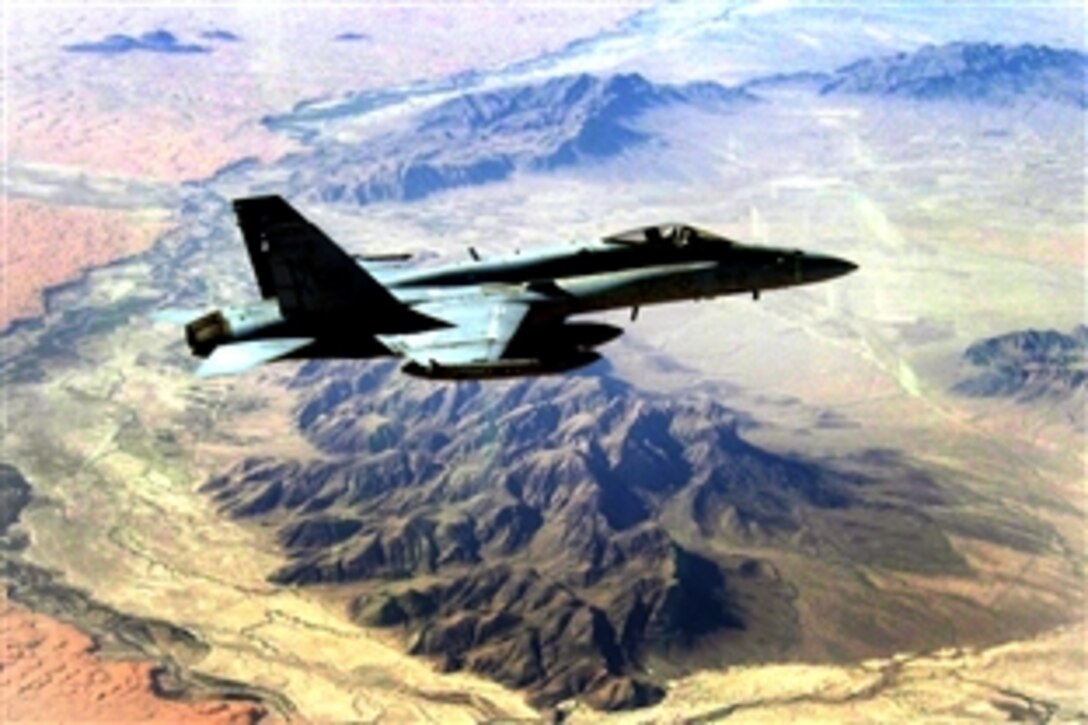 A U.S. Navy F/A-18C Hornet flies over the desert of southern Afghanistan providing support to coalition forces on the ground in Afghanistan, Oct. 9, 2008.  The aircraft and its pilot are assigned to Strike Fighter Squadron 113, from the Nimitz-class aircraft carrier USS Ronald Reagan and Carrier Air Wing 14.