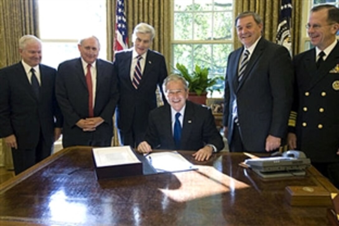 President George W. Bush is joined in the Oval Office, Oct. 14, 2008, for the signing of S. 3001, the Duncan Hunter National Defense Authorization Act for Fiscal Year 2009. With him from left are: U.S. Defense Secretary Robert Gates, U.S. Sen. Carl Levin, D-Mich.; U.S. Sen. John Warner, R-Va.; Republican Congressman Duncan Hunter of California, and U.S. Navy Adm. Mike Mullen, chairman of the Joint Chiefs of Staff. 