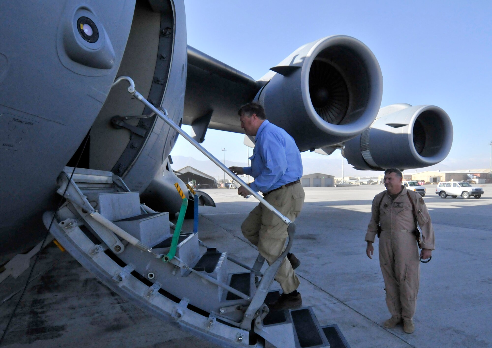 BAGRAM AIR FIELD, Afghanistan -- Secretary of the Air Force Michael Donley boards a C-17 Globemaster III here Oct. 15. Secretary Donley continued his tour through Southwest Asia. (U.S. Air Force photo by Staff Sgt. Samuel Morse/Released)