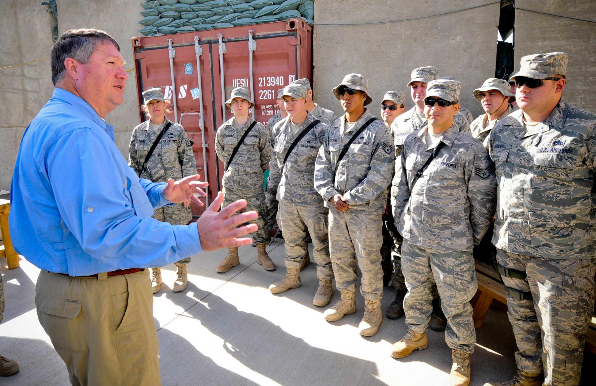 BAGRAM AIR FIELD, Afghanistan -- Secretary of the Air Force Michael Donley visits with the newly-created 455th Expeditionary Communications Squadron here Oct. 15. Secretary Donley learned about how the squadron is tackling the rising demands of the Air Force population at Bagram Air Field. (U.S. Air Force photo by Staff Sgt. Samuel Morse/Released)